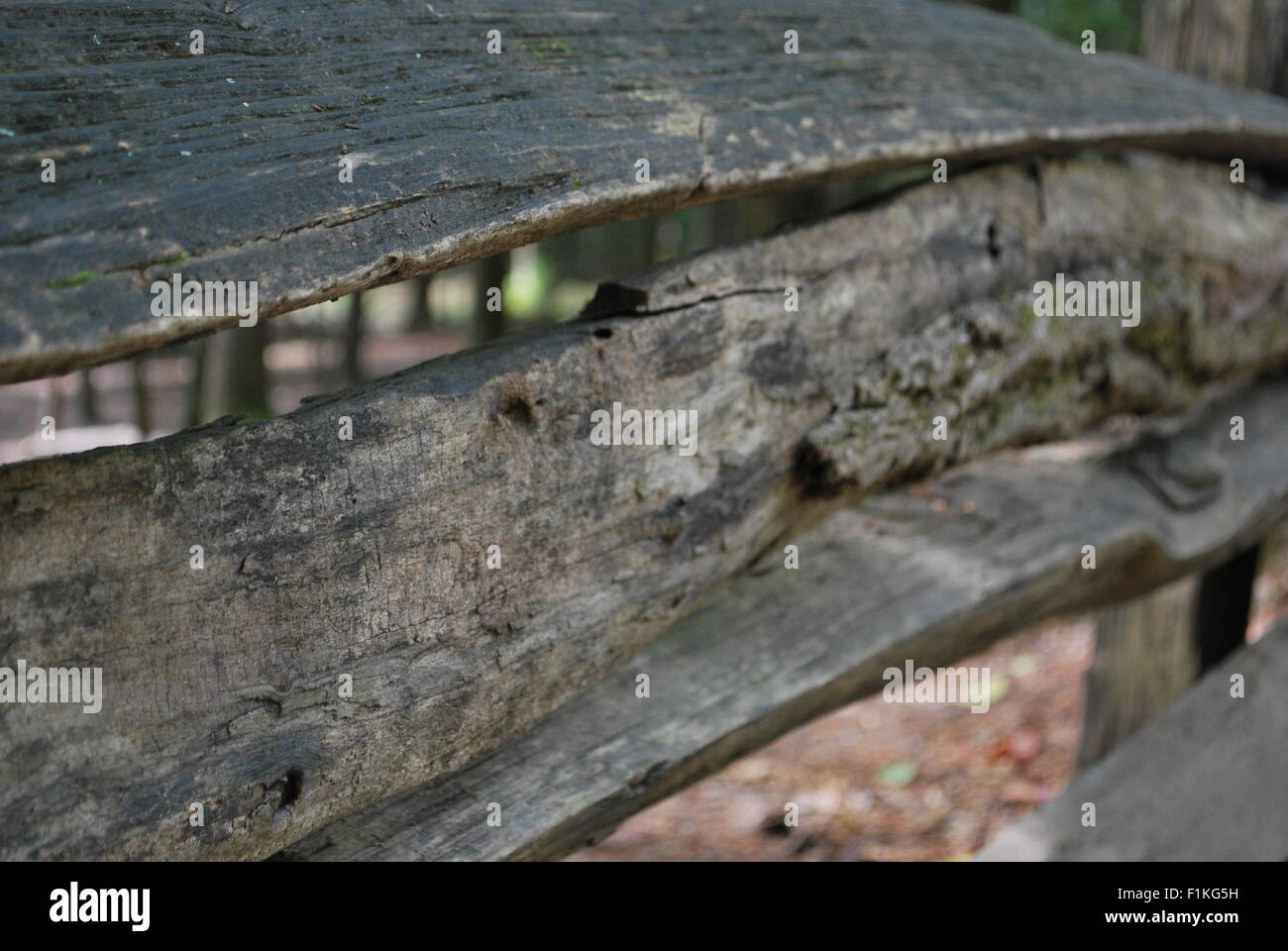 A close up of an old wooden fence with trees in the background Stock ...