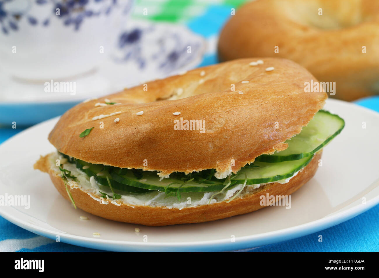 Bagel with cream cheese and cucumber Stock Photo Alamy