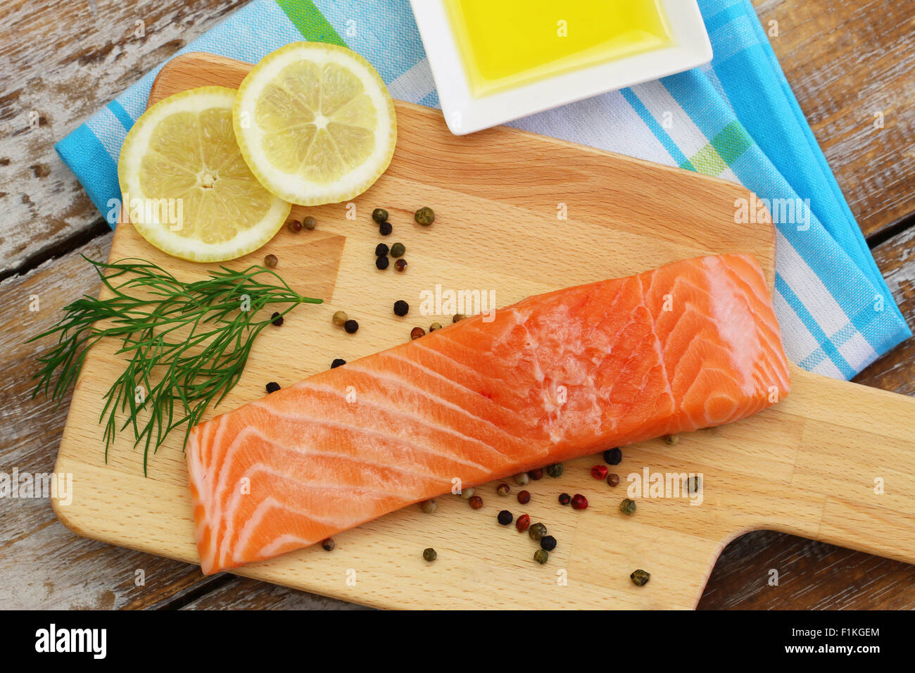 Raw salmon steak on wooden board Stock Photo