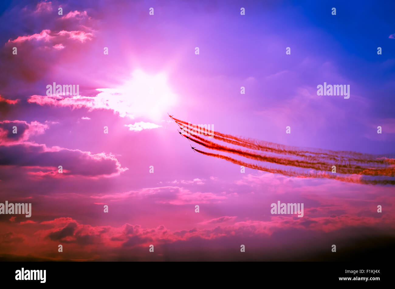 Airplanes on airshow. Aerobatic team performs flight on twilight at air show. Stock Photo