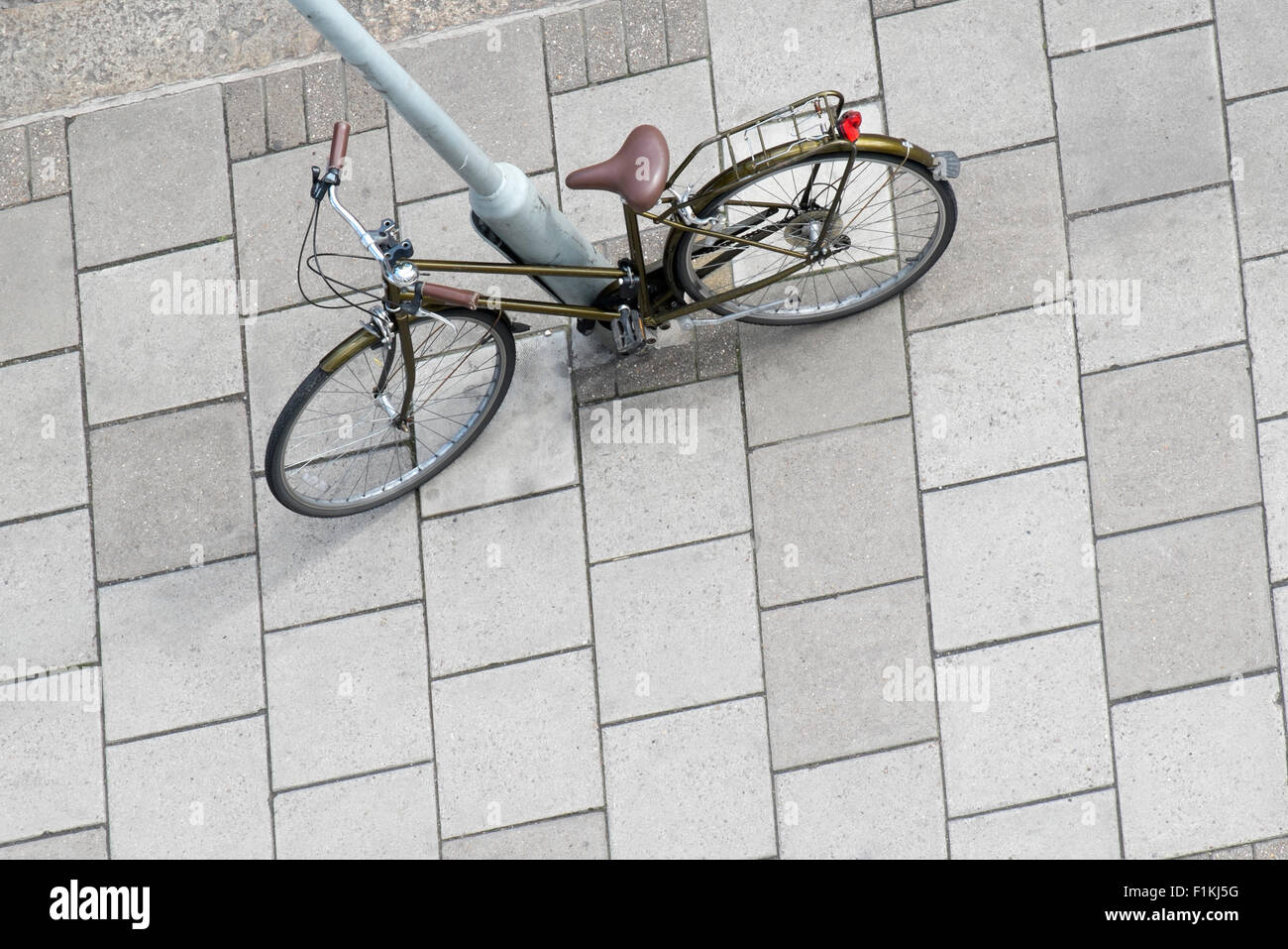 High viewpoint of bicycle leaning against lampost, Mornington Crescent, London Stock Photo
