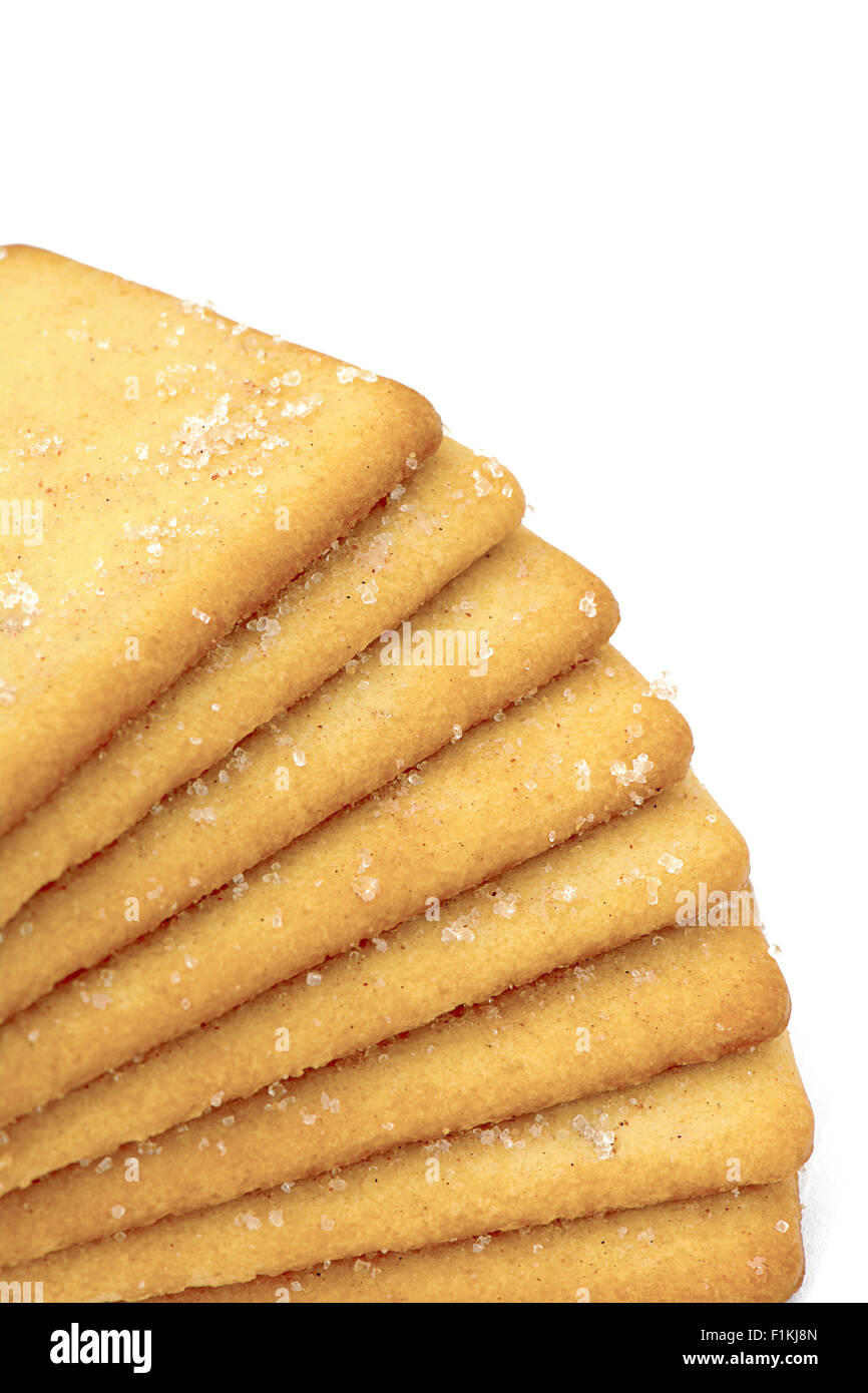 Selective focus on a stack of plain sugar biscuits on a white background , room for text and copy space Stock Photo