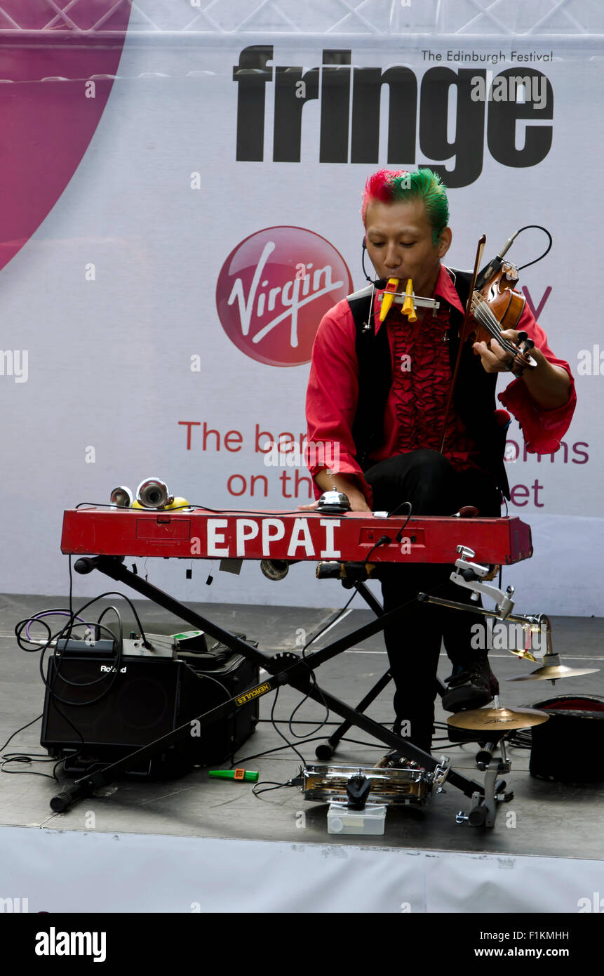 Japanese children's entertainer musician busking at the Edinburgh Festival Fringe in 2015. Stock Photo