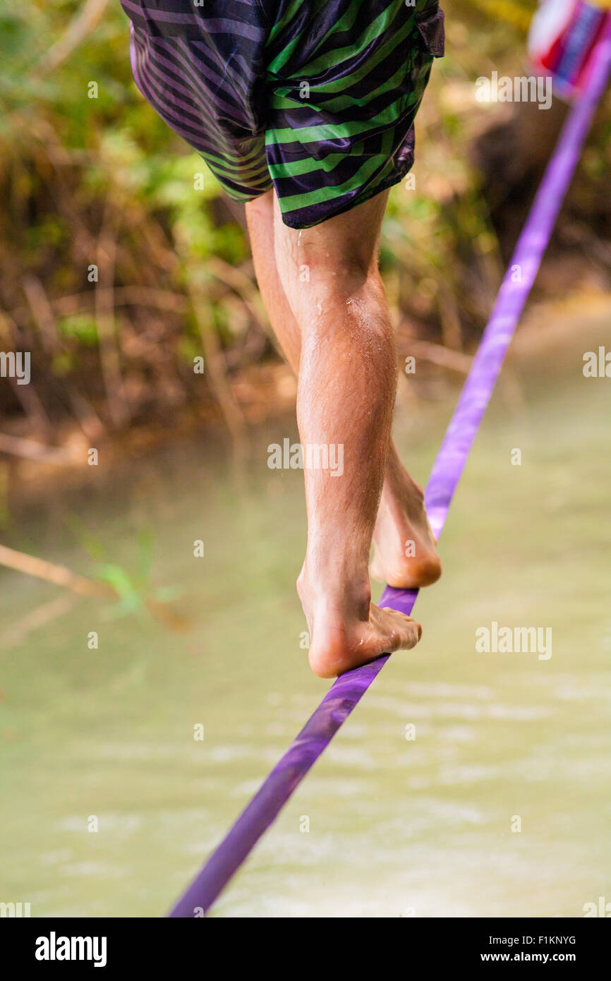 People walk on a tightrope Slackline Stock Photo Alamy