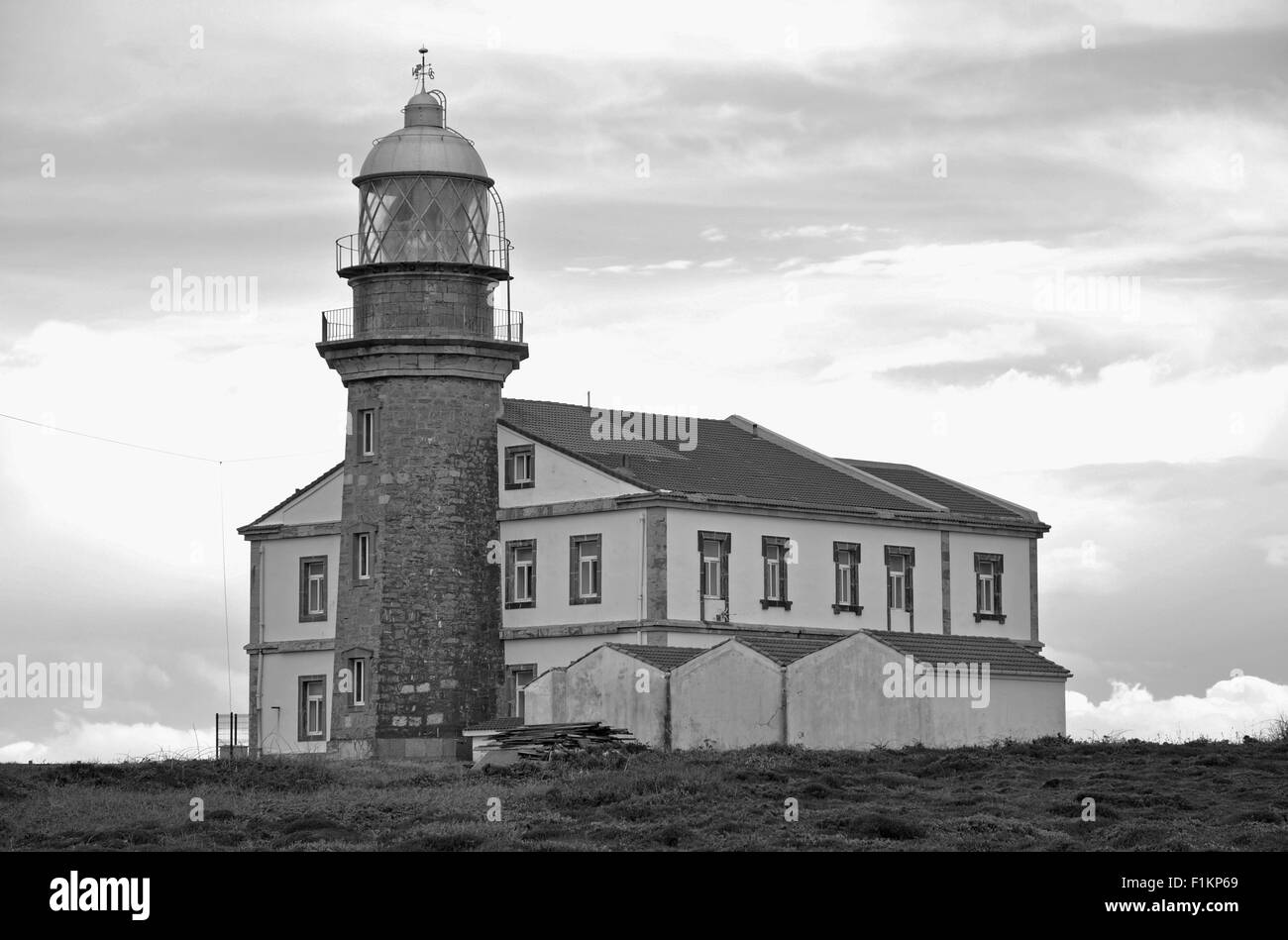 Faro de Cabo de Peñas, a XIX century lighthouse in Cabo de Peñas Protected Landscape (Gozón, Principality of Asturias, Cantabrian Sea, Spain). B&W Stock Photo