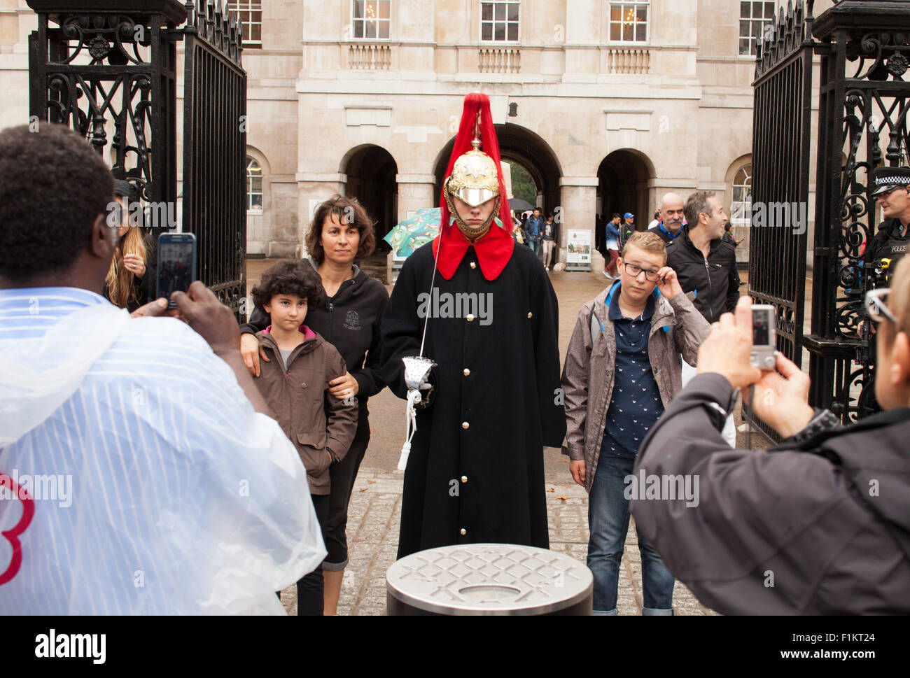 Tourists taking picture with Life Guard Trooper , Whitehall, London,UK Stock Photo
