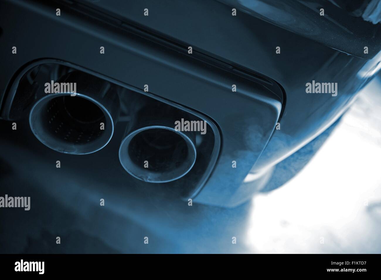 Smoking Exhaust Closeup. Modern Car Exhaust. Ecology in Transportation