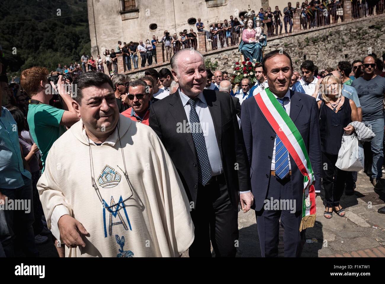 San Luca, Italy. 02nd Sep, 2015. The Prefectural Commissioner Salvatore Gullì (left), the pastor of the Sanctuary of Santa Maria di Polsi, Don Pino Strangio (center) and the president of the province of Reggio Calabria, Giuseppe Raffa (right), join the parade and headed the procession. The Sanctuary of Our Lady of Polsi is also known as the Sanctuary of Santa Maria di Polsi or the Our Lady of the Mountain. It is a Christian sanctuary in the heart of the Aspromonte mountains, near San Luca in Calabria, southern Italy. © Michele Amoruso/Pacific Press/Alamy Live News Stock Photo