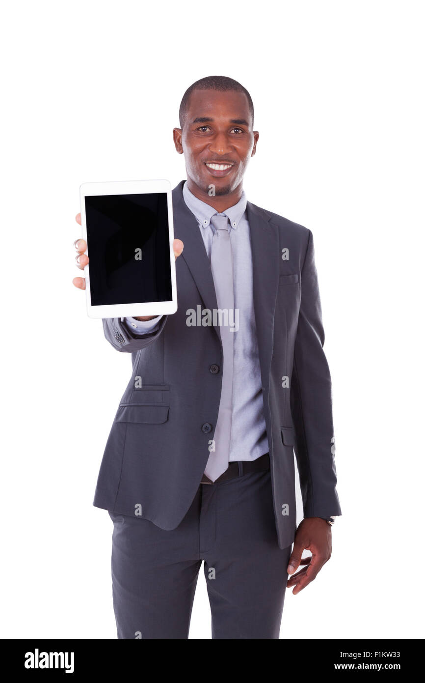 African american business man using a tactile tablet over white ...
