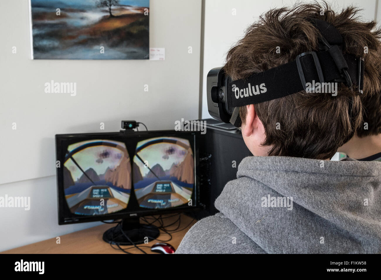 Teenage boy playing an Oculus Rift virtual reality device Stock Photo