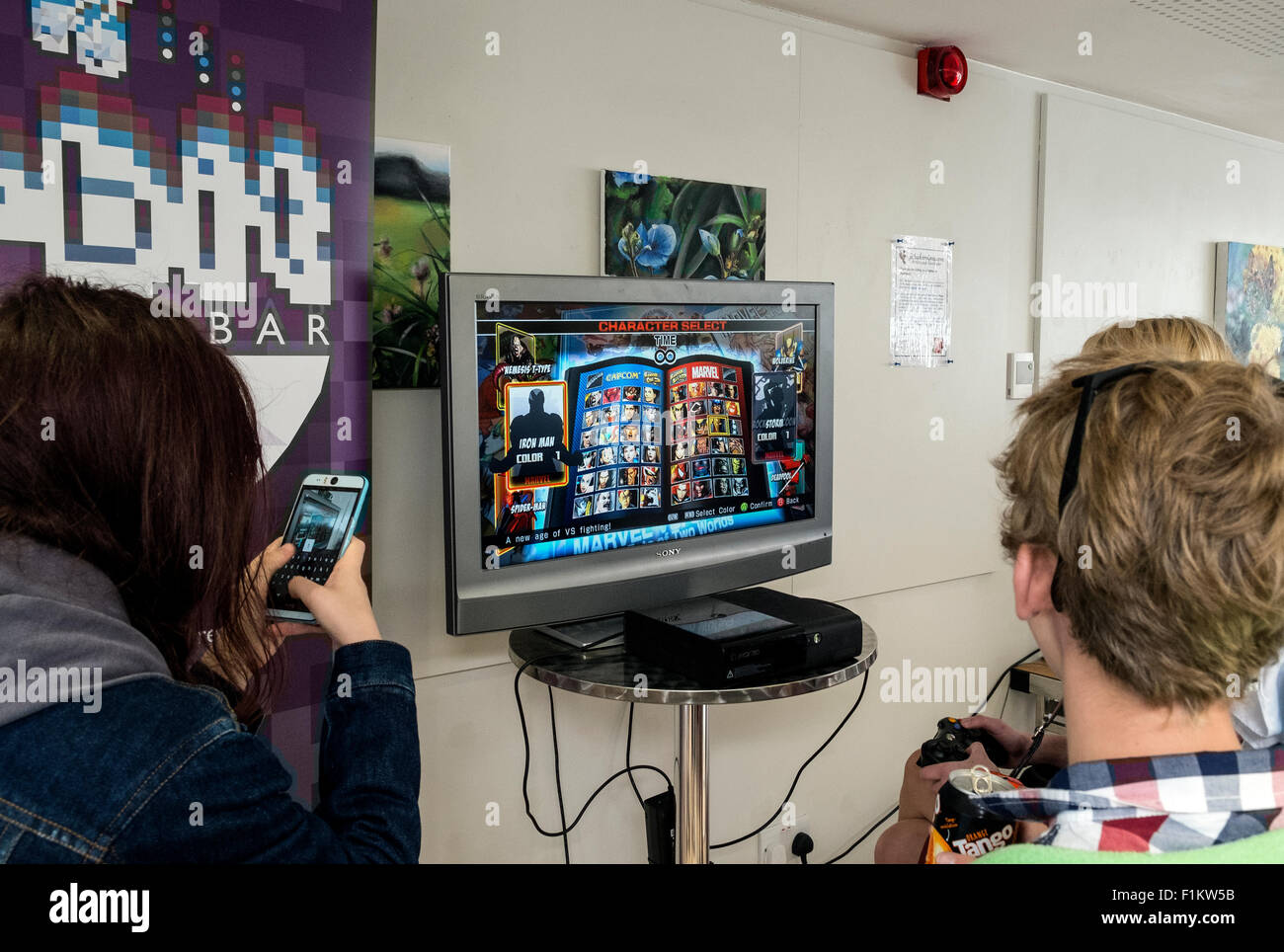 Teenagers playing online games in a youth club, uk Stock Photo