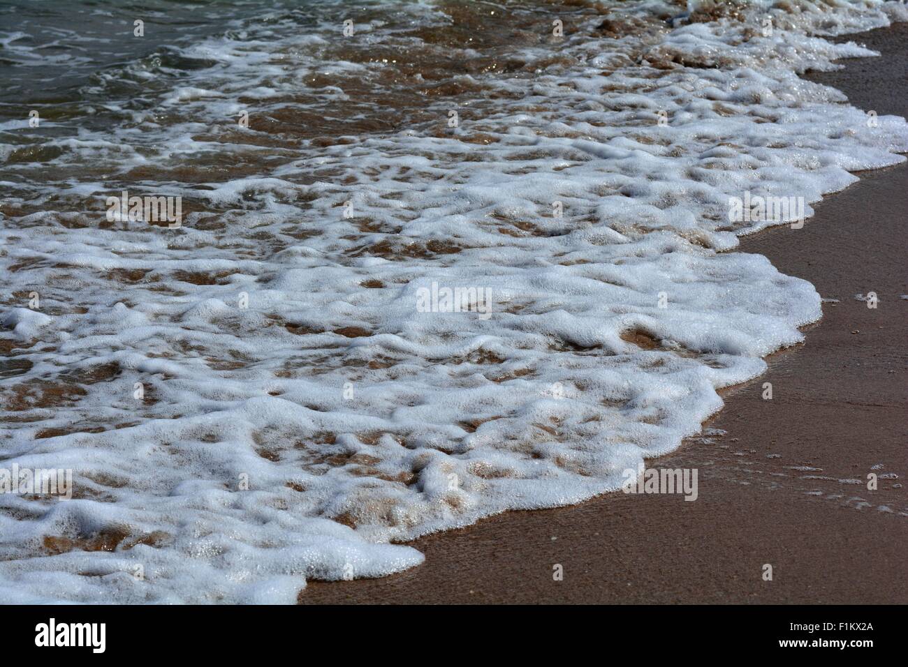 Sand and waves Stock Photo