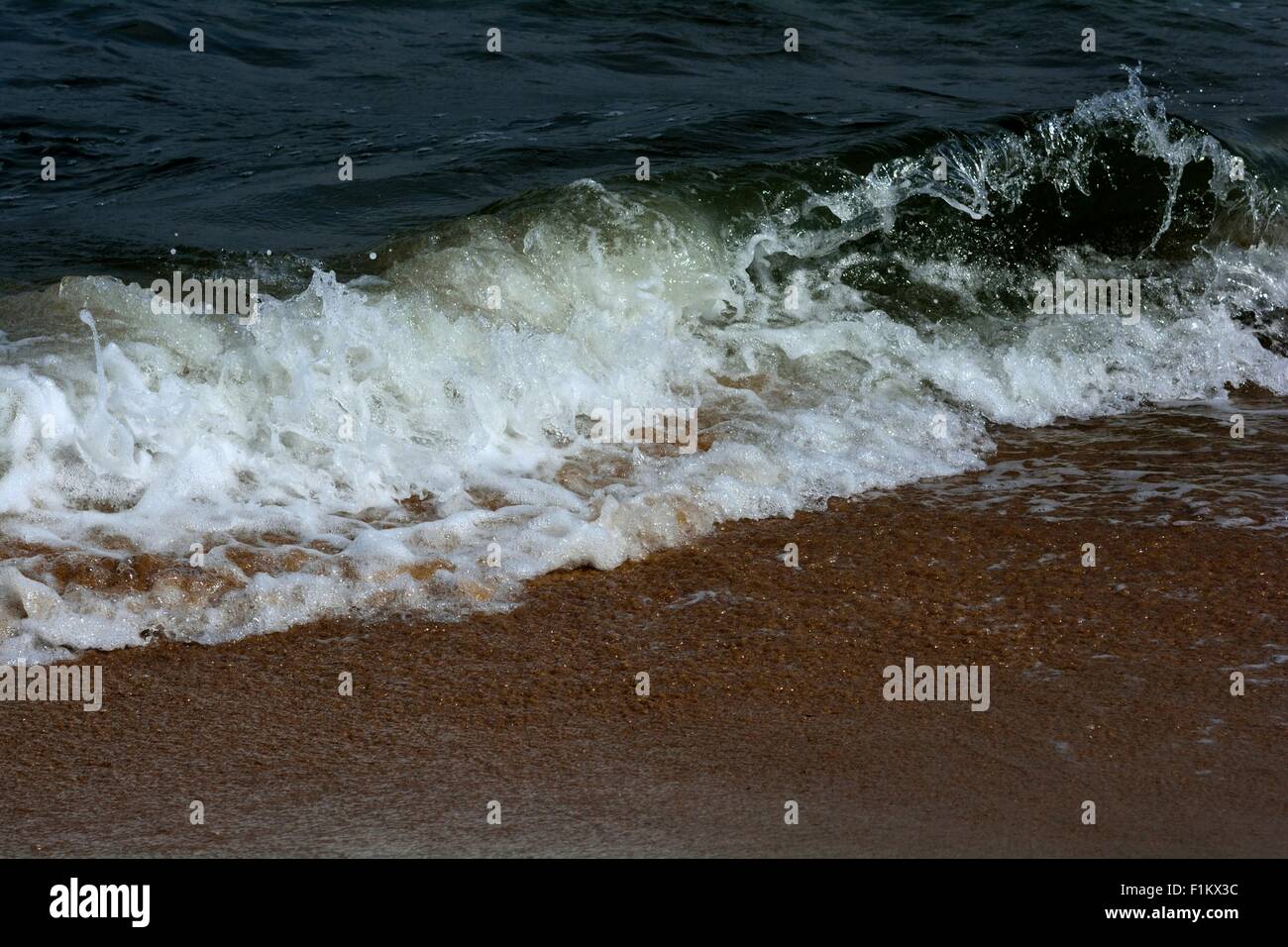 Sand and waves Stock Photo