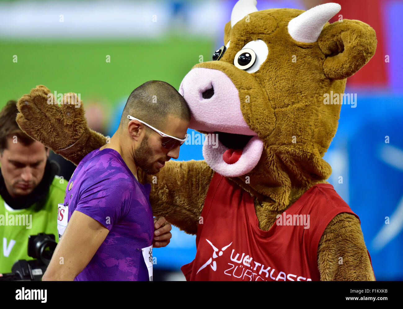 Zurich, Switzerland. 03rd Sep, 2015. Meeting mascot Cooly hugs Swiss local idol Kariem Hussein (SUI) after he won the 400m hurdles race at the 2015 Zurich IAAF Diamond League athletics meeting. Credit:  Erik Tham/Alamy Live News Stock Photo