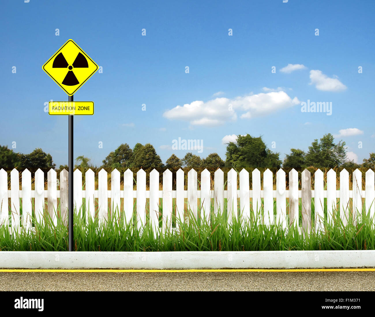 nuclear radiation warning symbol with blue sky Stock Photo