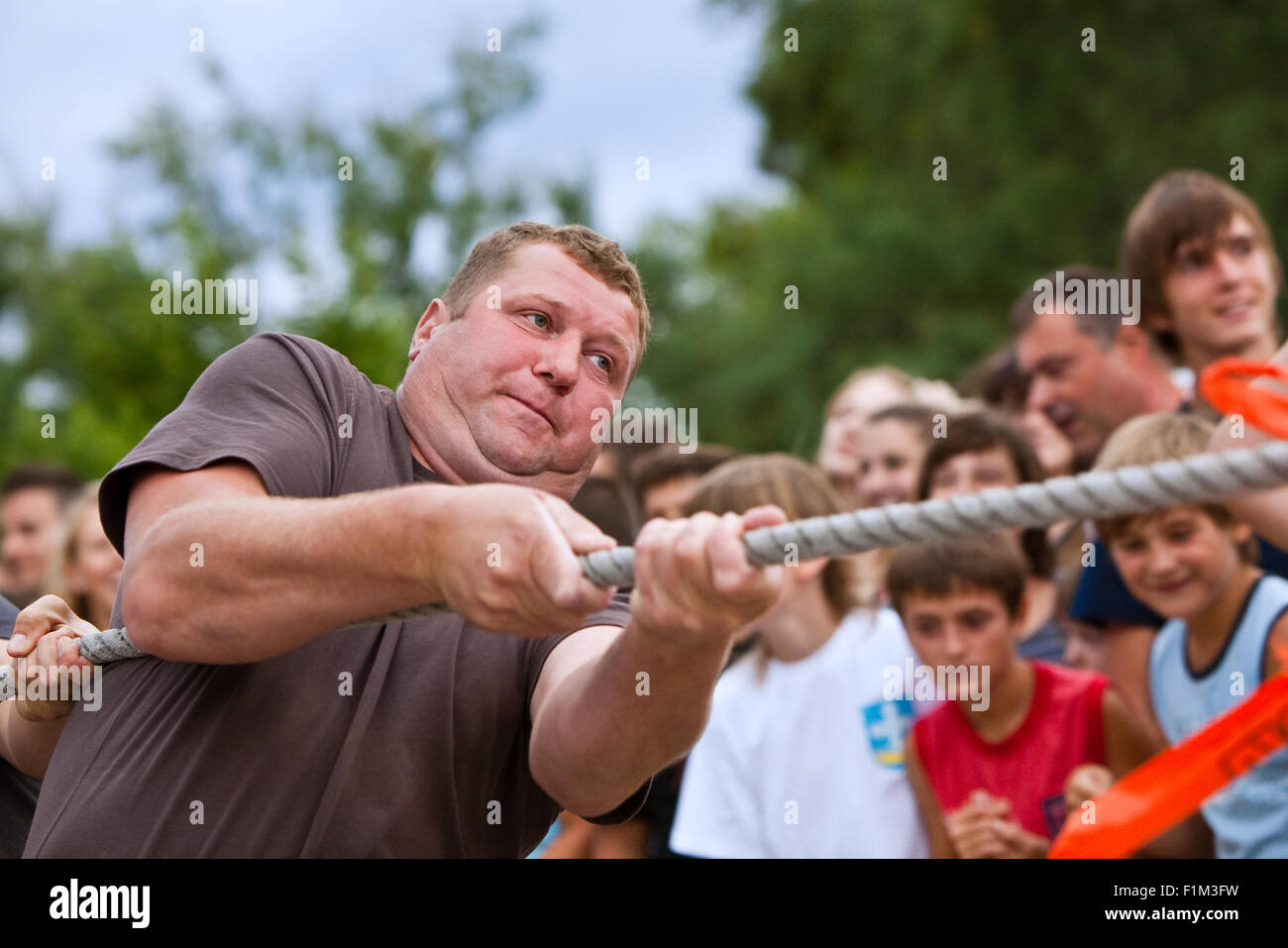 Man playing rope pulling, Kukljica, island Ugljan, Dalmatia, Croatia ...