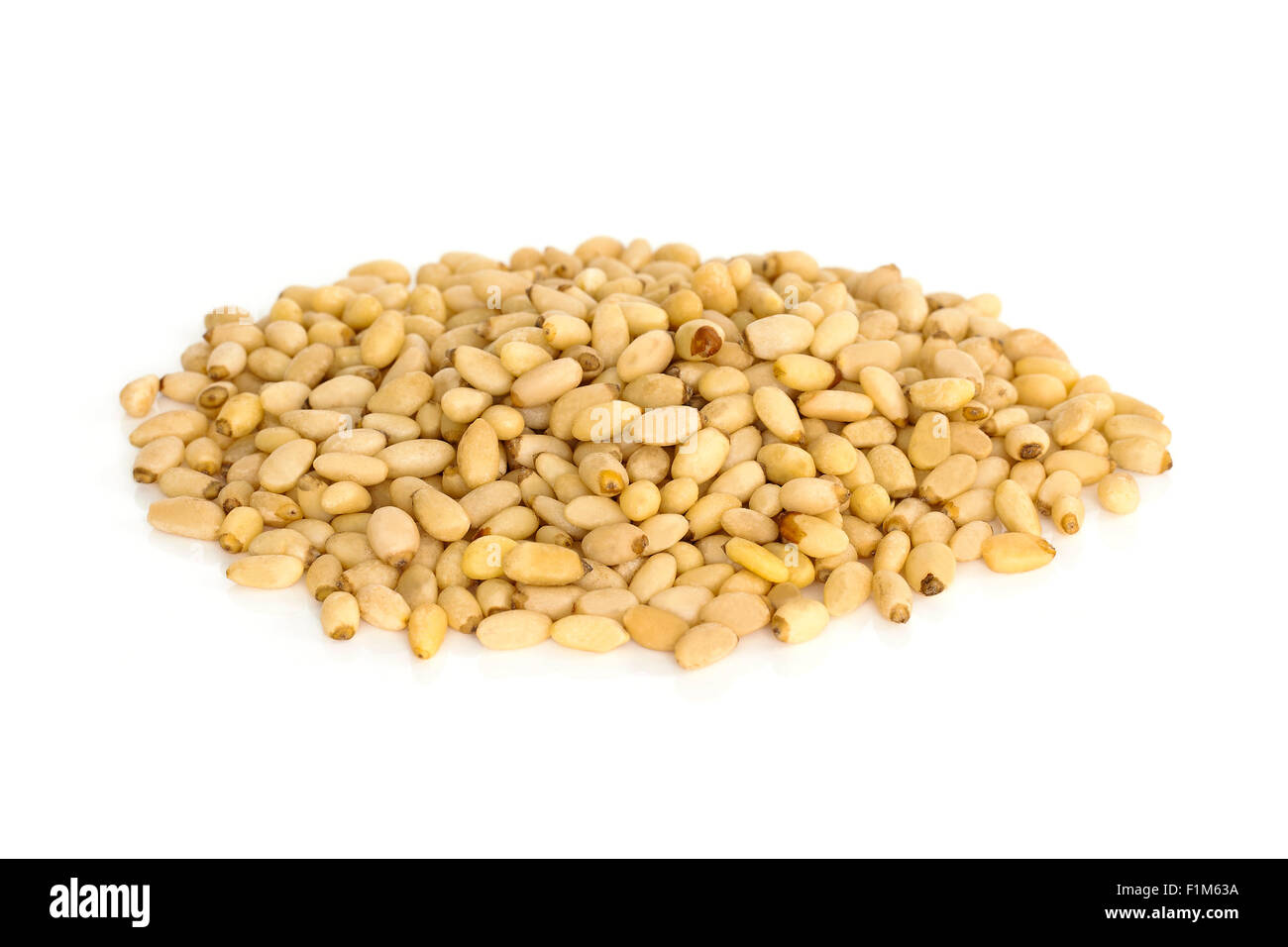 Pine nuts from above isolated on white background. Stock Photo
