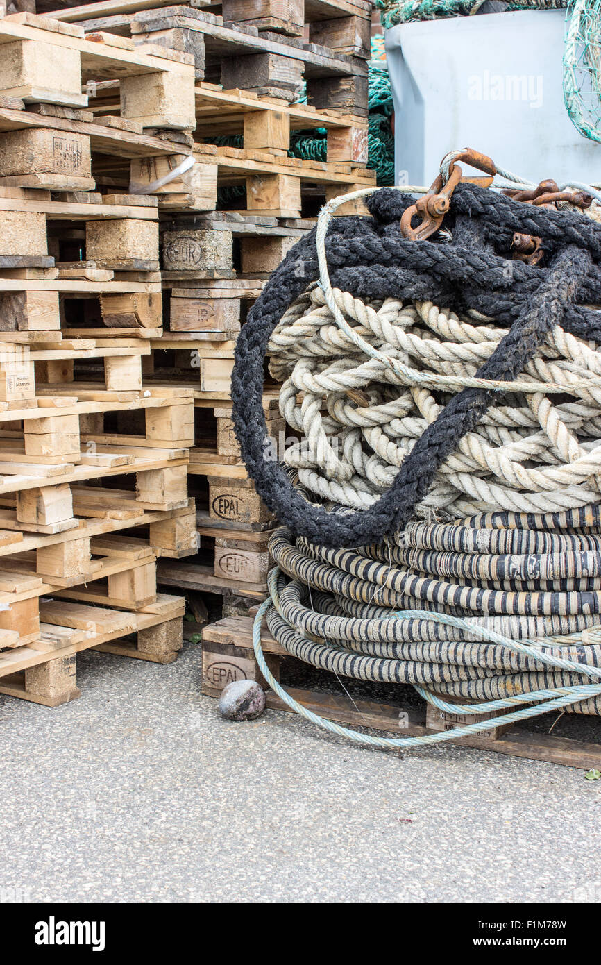 several ship ropes and wooden pallets Stock Photo