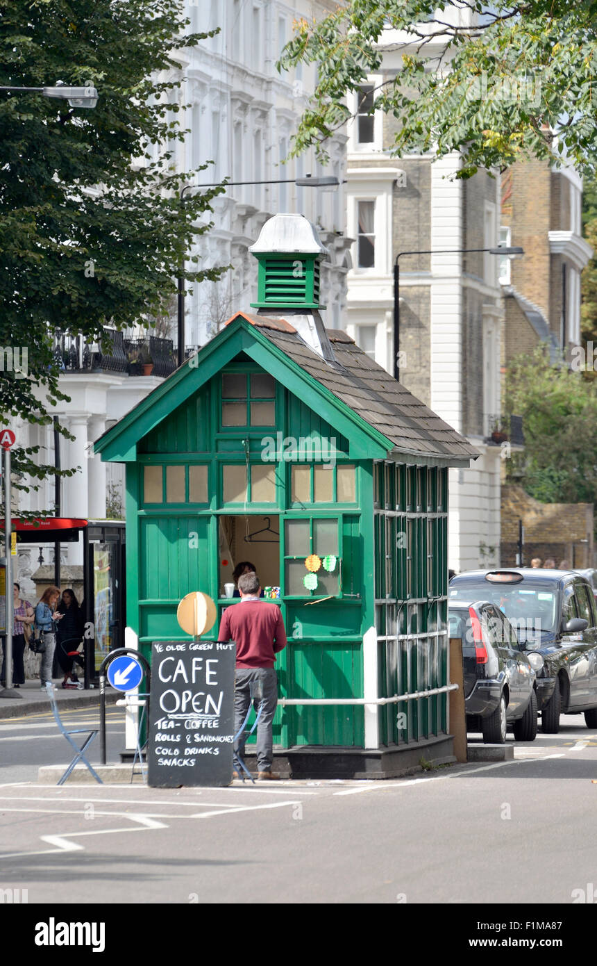 London, England, UK. Cabman's Shelter in Kensington Park Road.  Dating from 1875, small wooden structures offering shelter and r Stock Photo