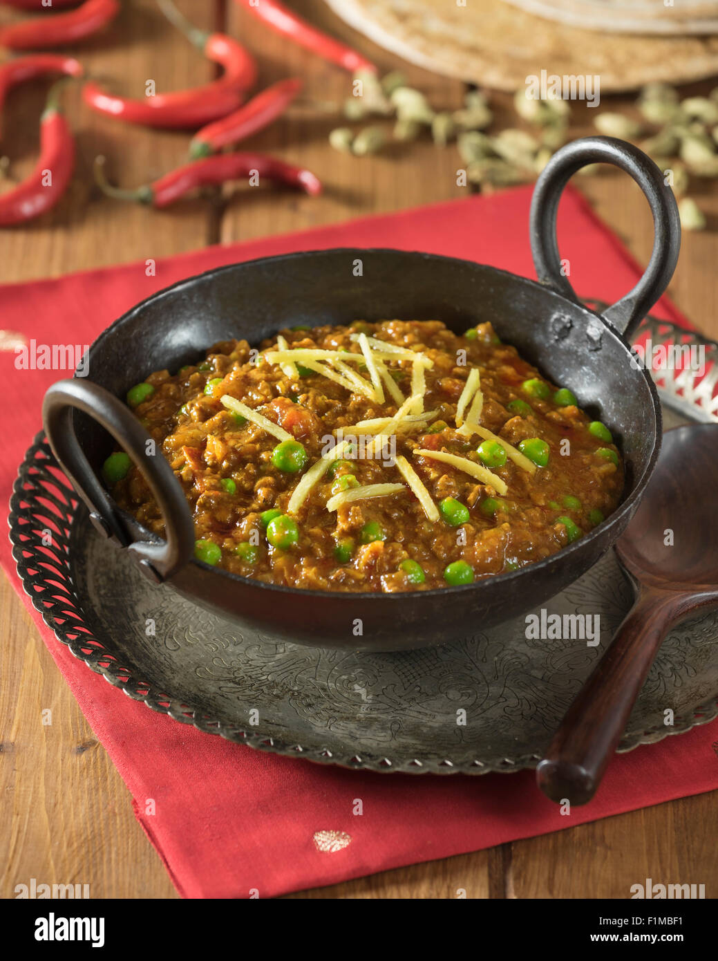 Keema curry. Spicy minced lamb in karahi cooking pot. India Food Stock Photo