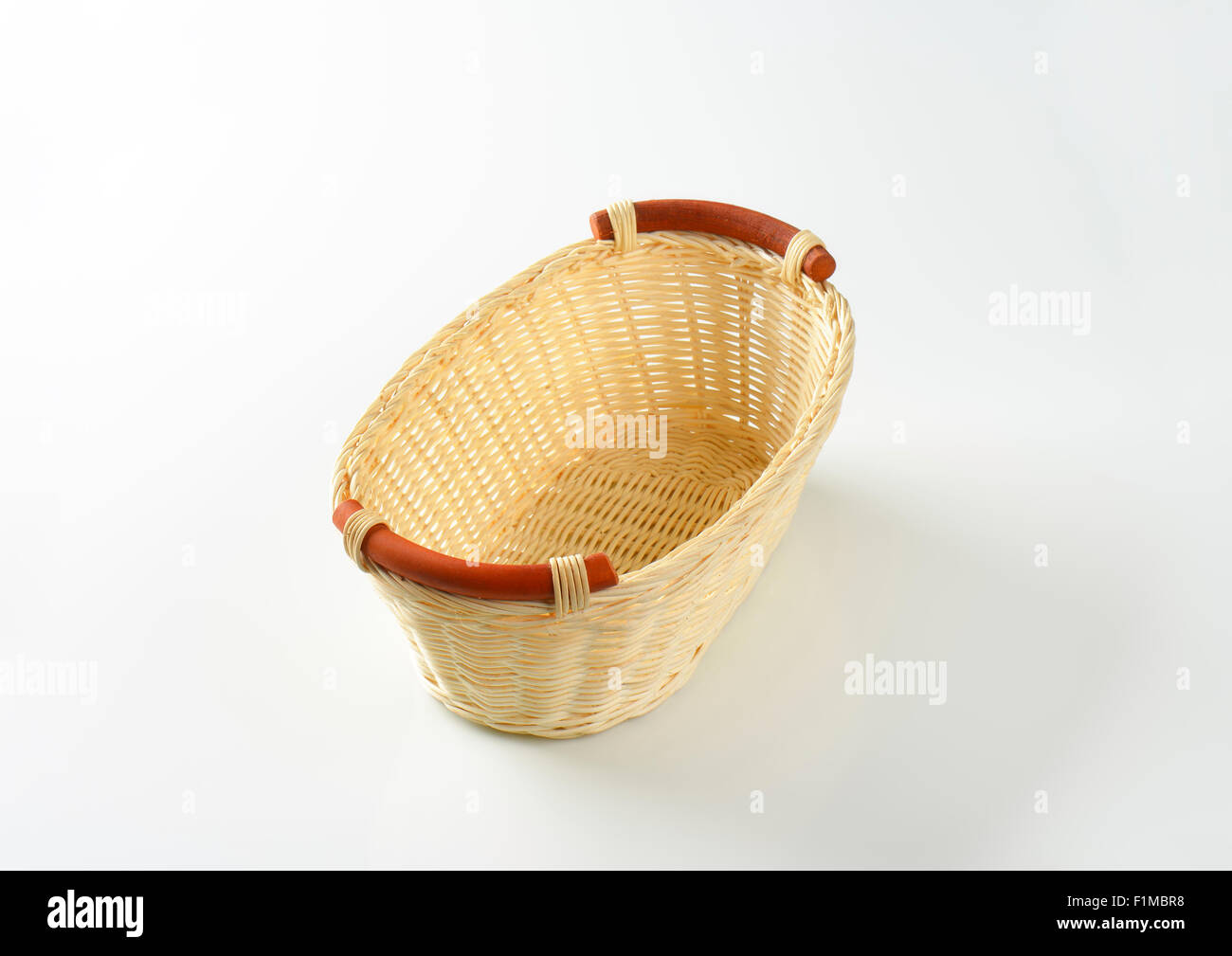 empty wicker basket on white background Stock Photo - Alamy