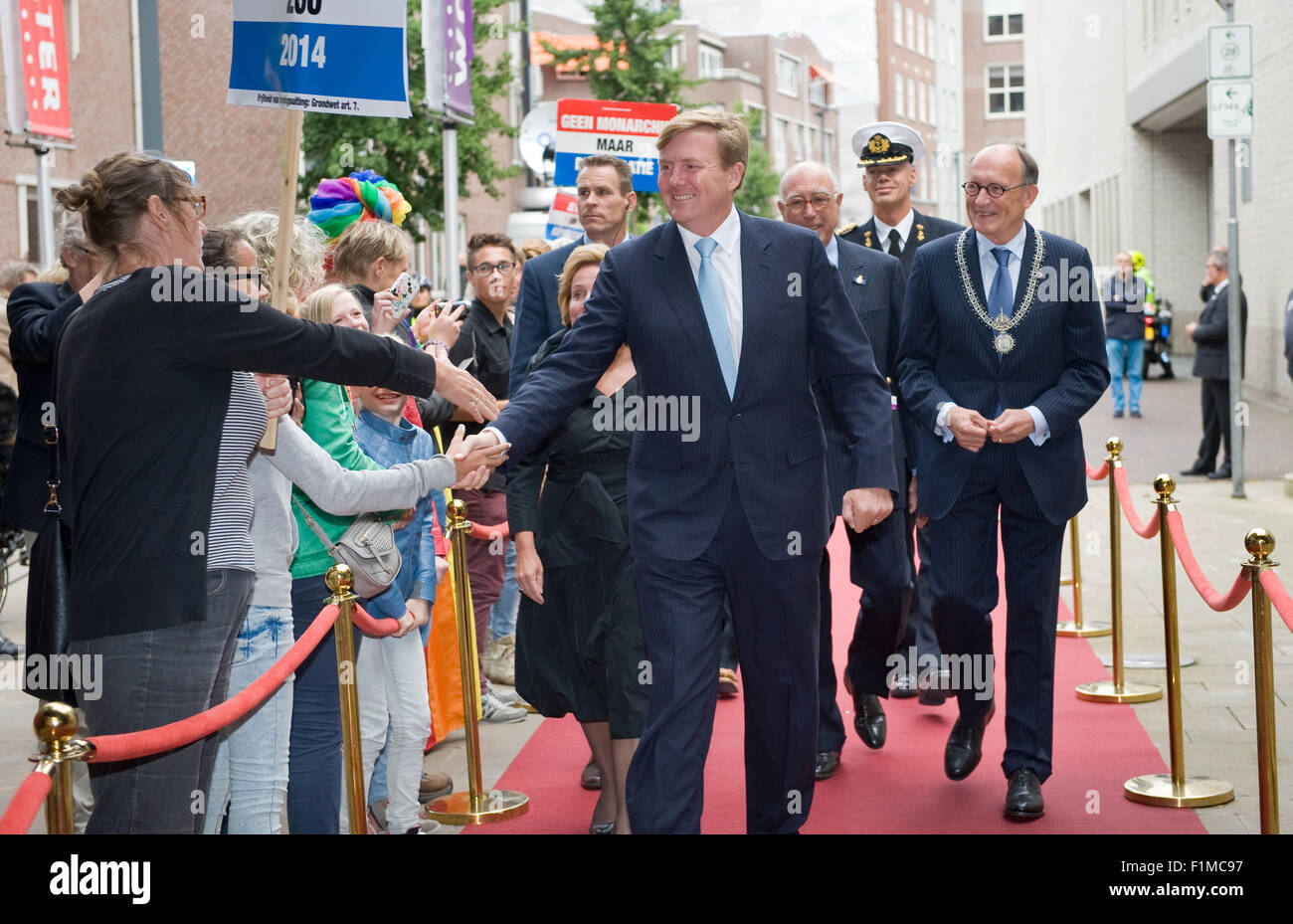 King Willem Alexander from The Netherlands is shaking hands with people while he is going to visit a theater Stock Photo