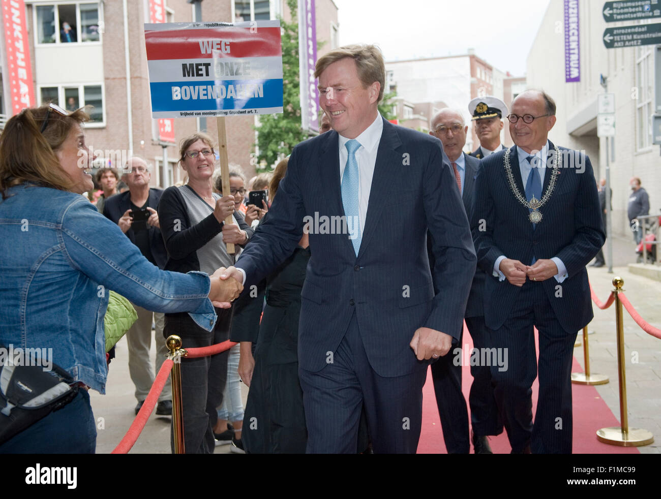 King Willem Alexander from The Netherlands is shaking hands with people while he is going to visit a theater Stock Photo