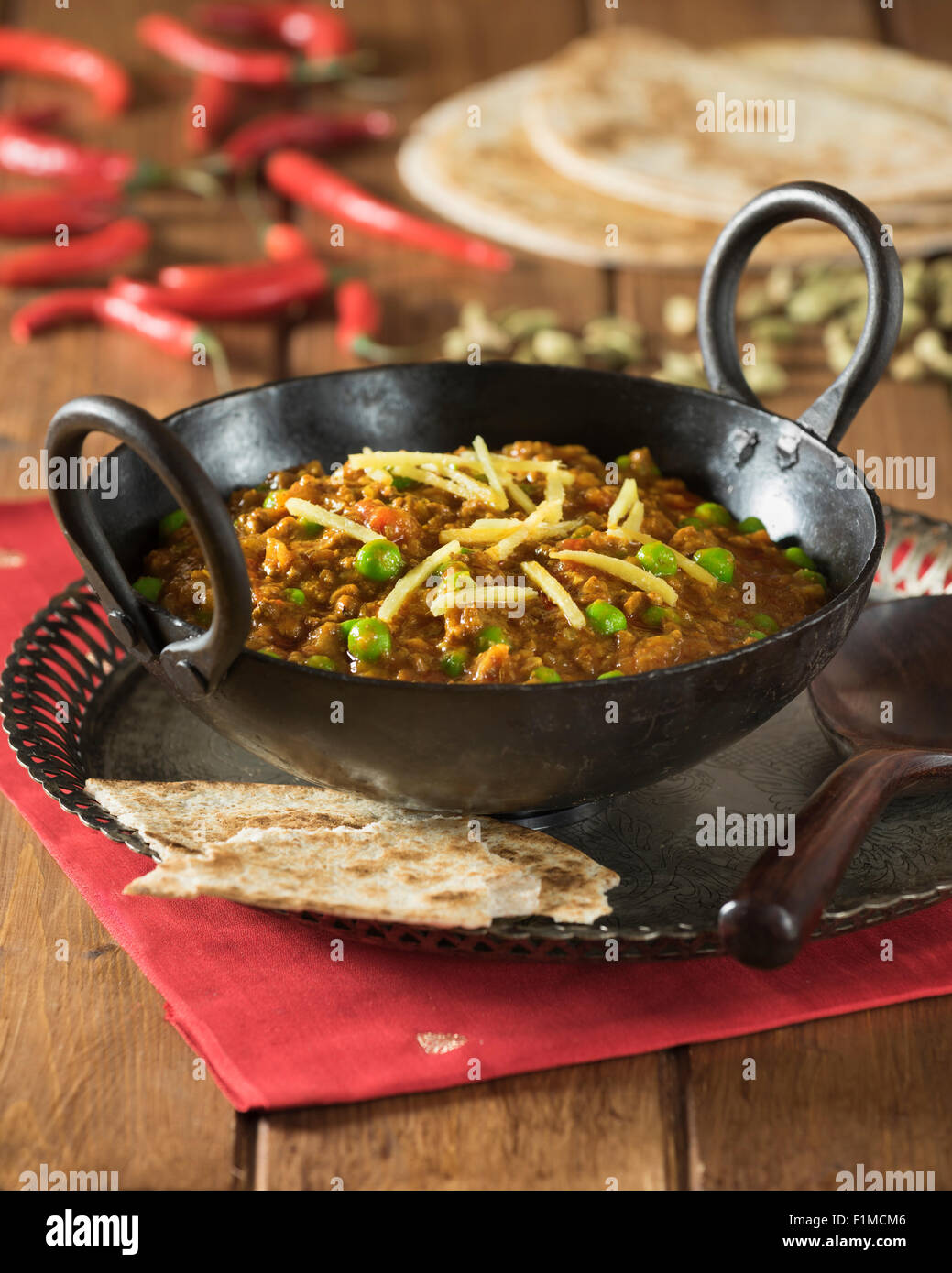 Keema curry. Spicy minced lamb in karahi cooking pot. India Food Stock Photo