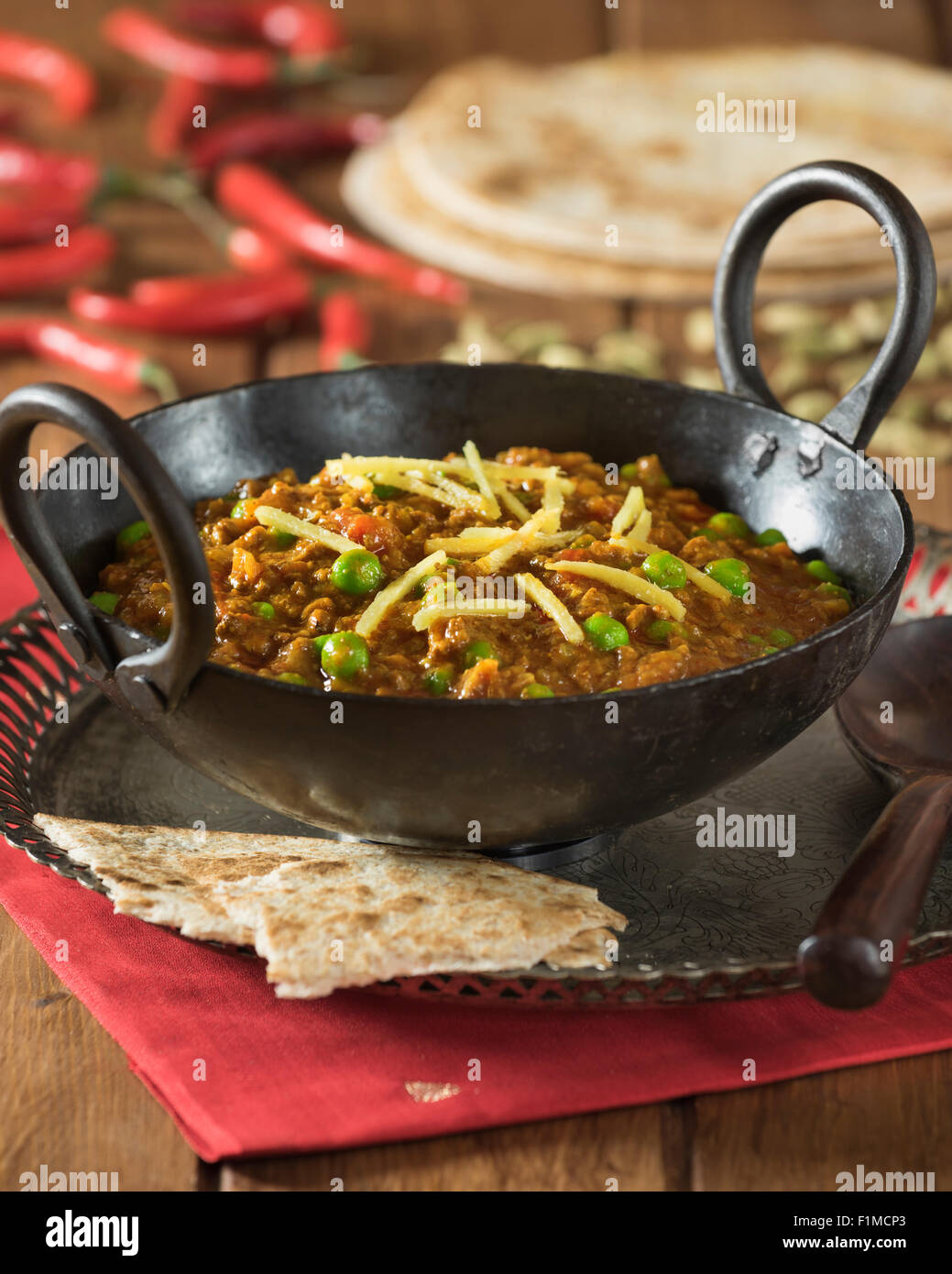 Keema curry. Spicy minced lamb in karahi cooking pot. India Food Stock Photo