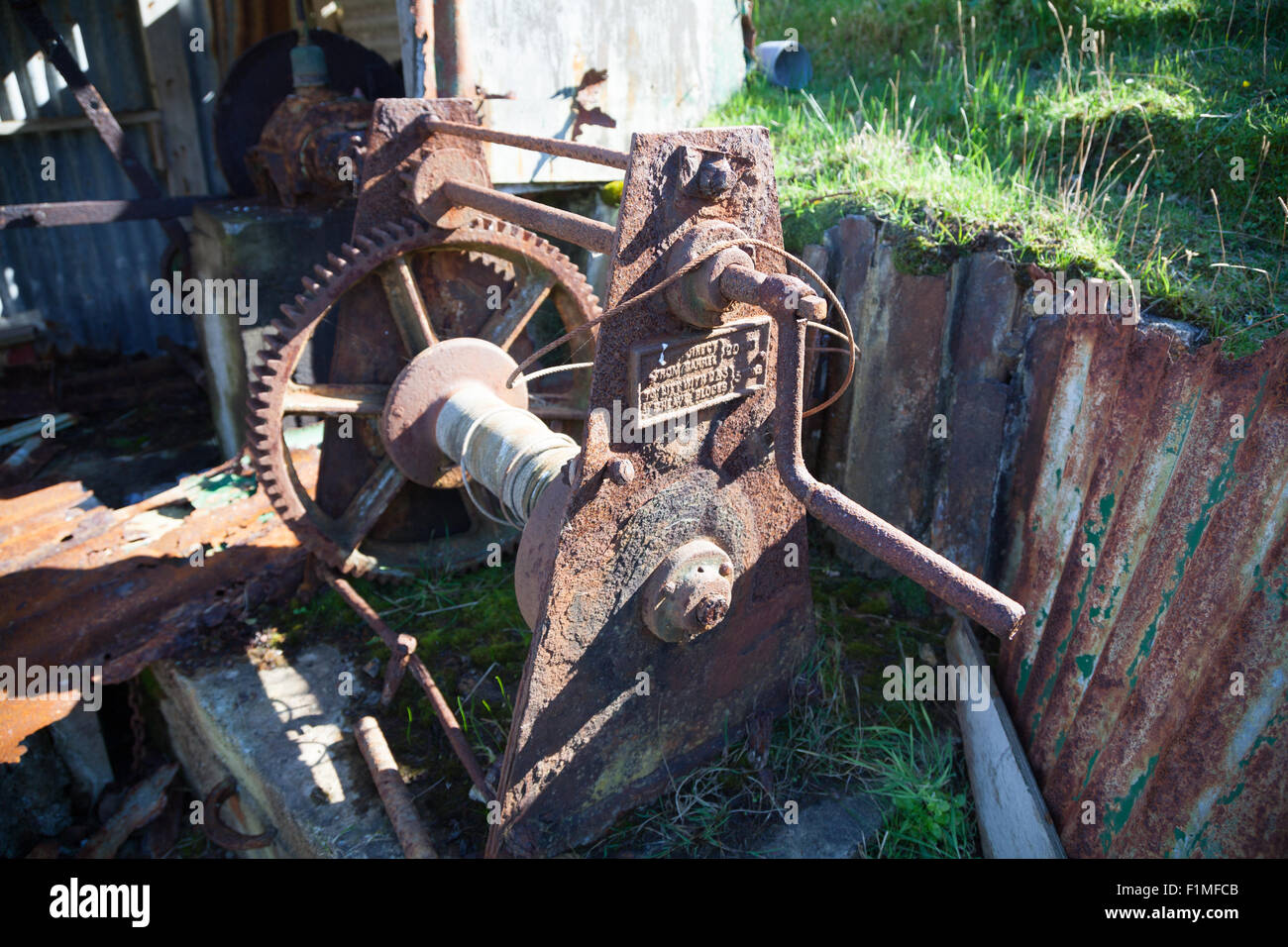 Old rusted fisherman's boat winding gear / winch with crank handle at