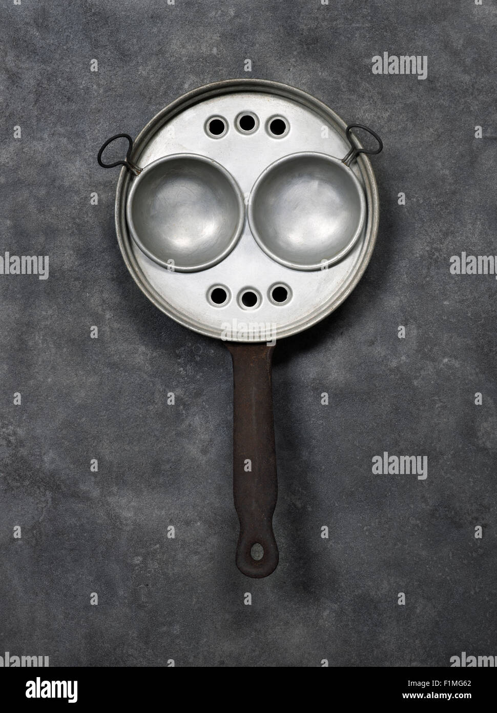 Old Vintage Egg Poaching Pan or Poacher Stock Photo