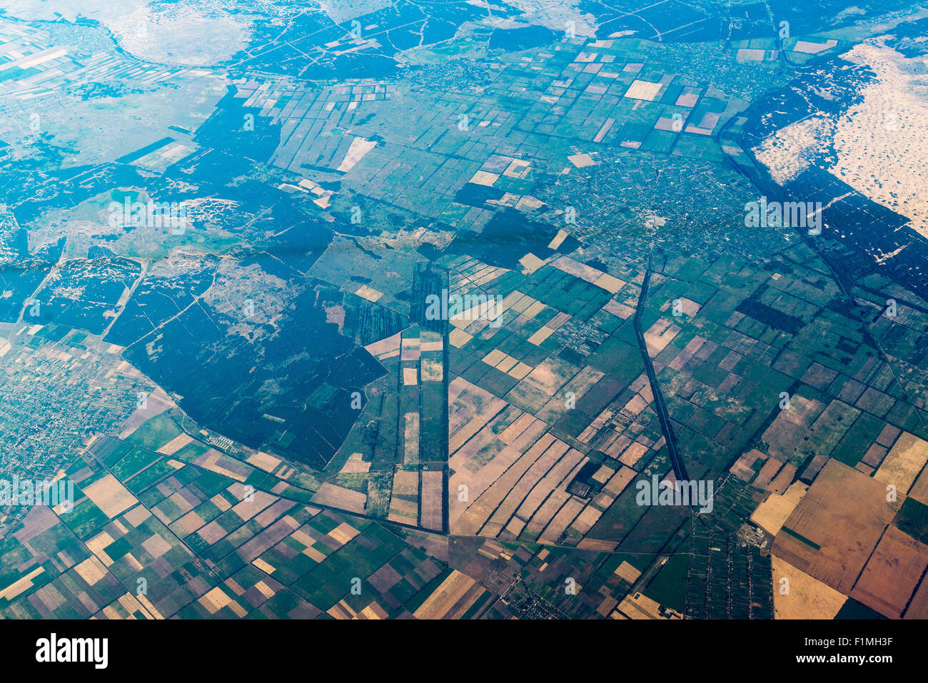 air view on landscape with geometric shaped vegetable gardens Stock Photo