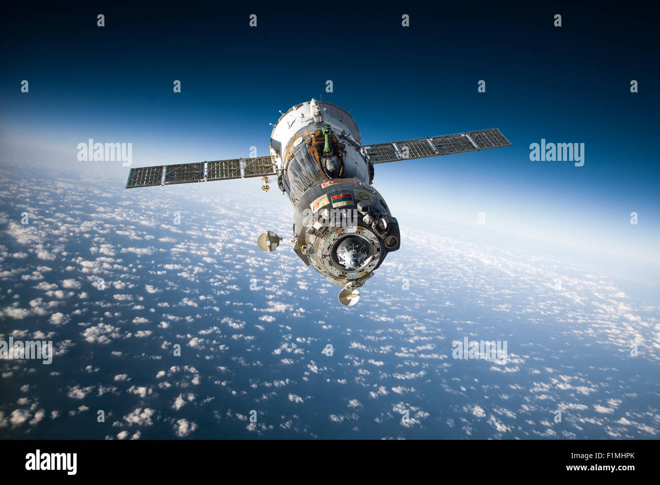 Spacecraft Soyuz orbiting the earth. Elements of this image furnished by NASA. Stock Photo