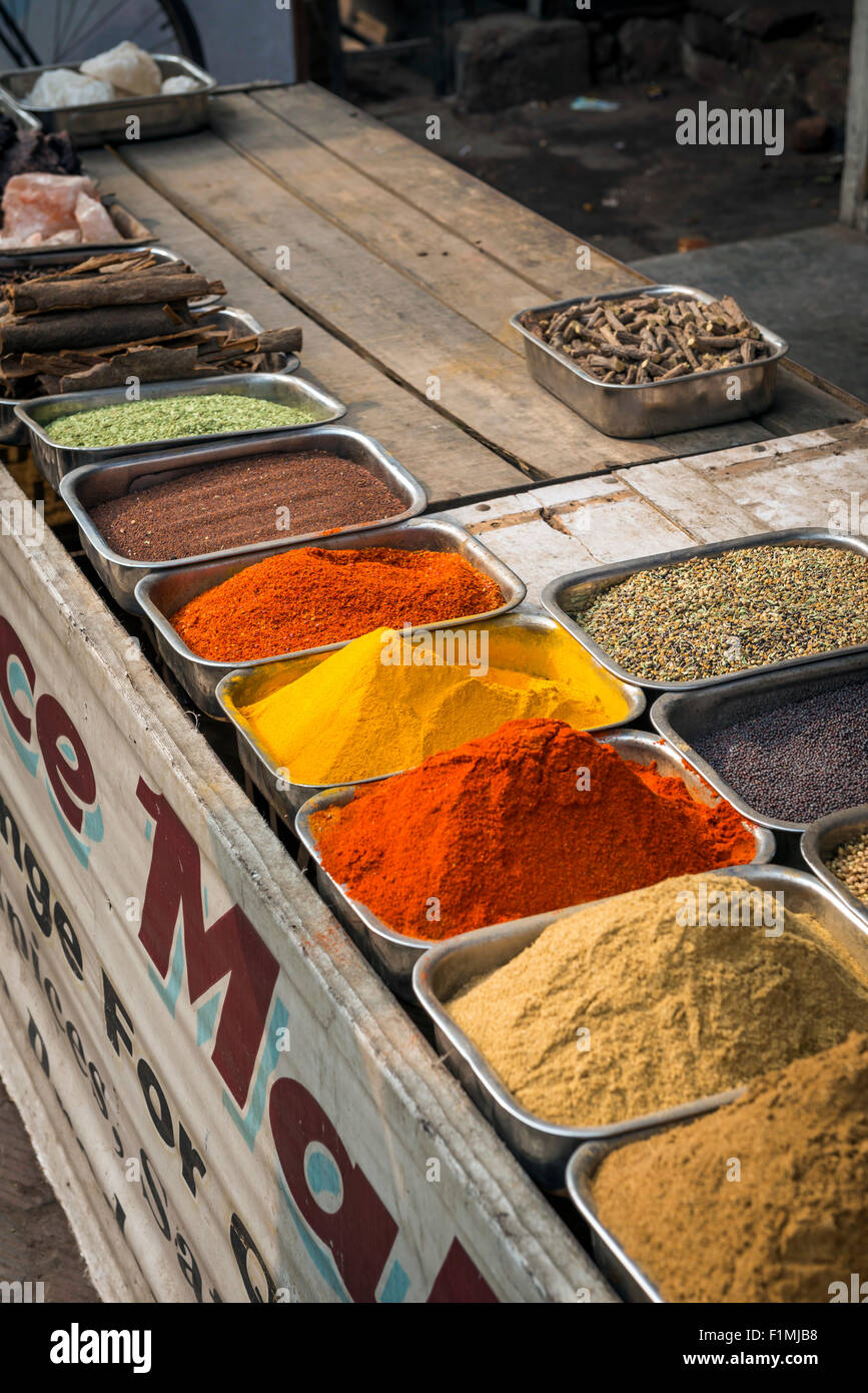 Dishes of piled spice outside a shop near Main Bazaar in the Paharganj District of New Delhi, India Stock Photo