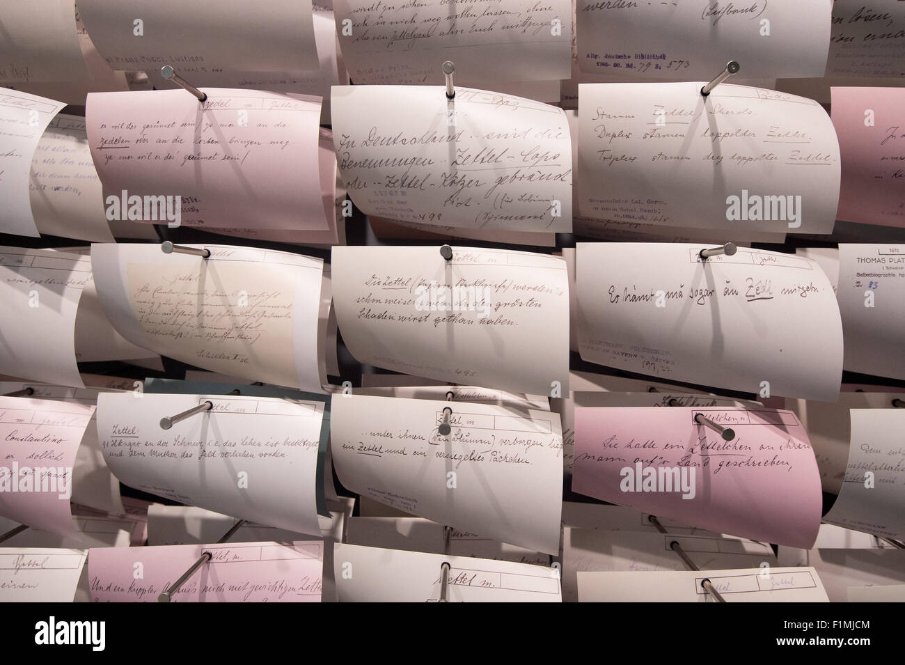Kassel, Germany. 04th Sep, 2015. Handwritten notes on slips of paper per headword (or lemma) which the brothers Grimm used to structure their German dictionary are seen on the opening day of the new exhibition house 'Grimmwelt' (lit. Grimm world) in Kassel, Germany, 04 September 2015. The new Grimm museum opens after two years of construction works. Photo: Swen Pfoertner/dpa/Alamy Live News Stock Photo