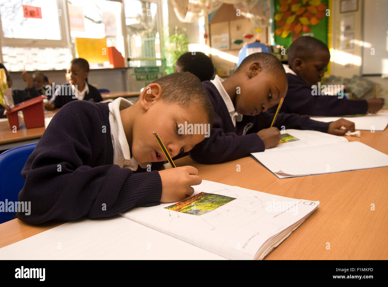 Primary school pupil's at work in classroom, London, UK. Stock Photo