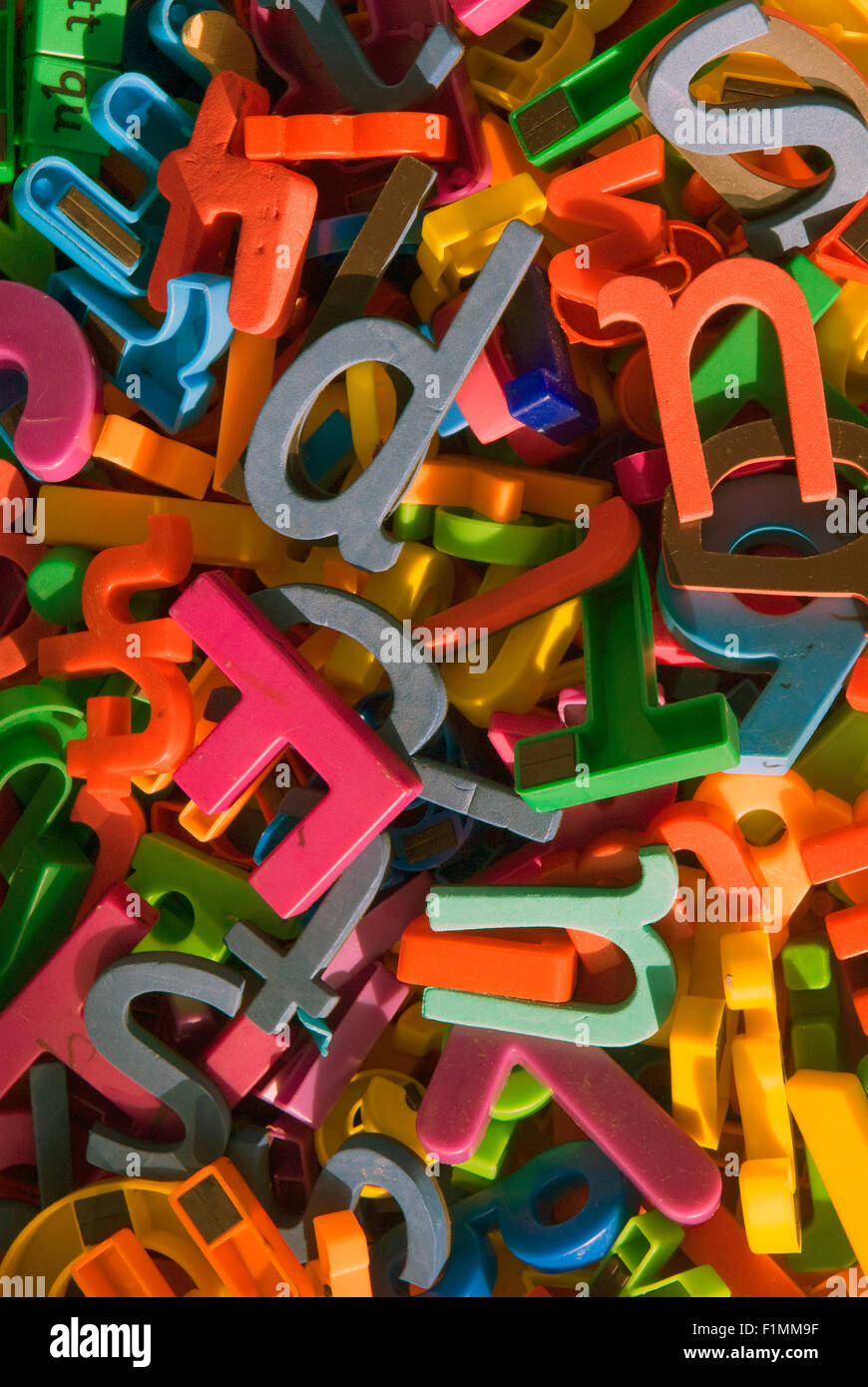 Assorted coloured letters as learning aids in primary school classroom, London, UK. Stock Photo