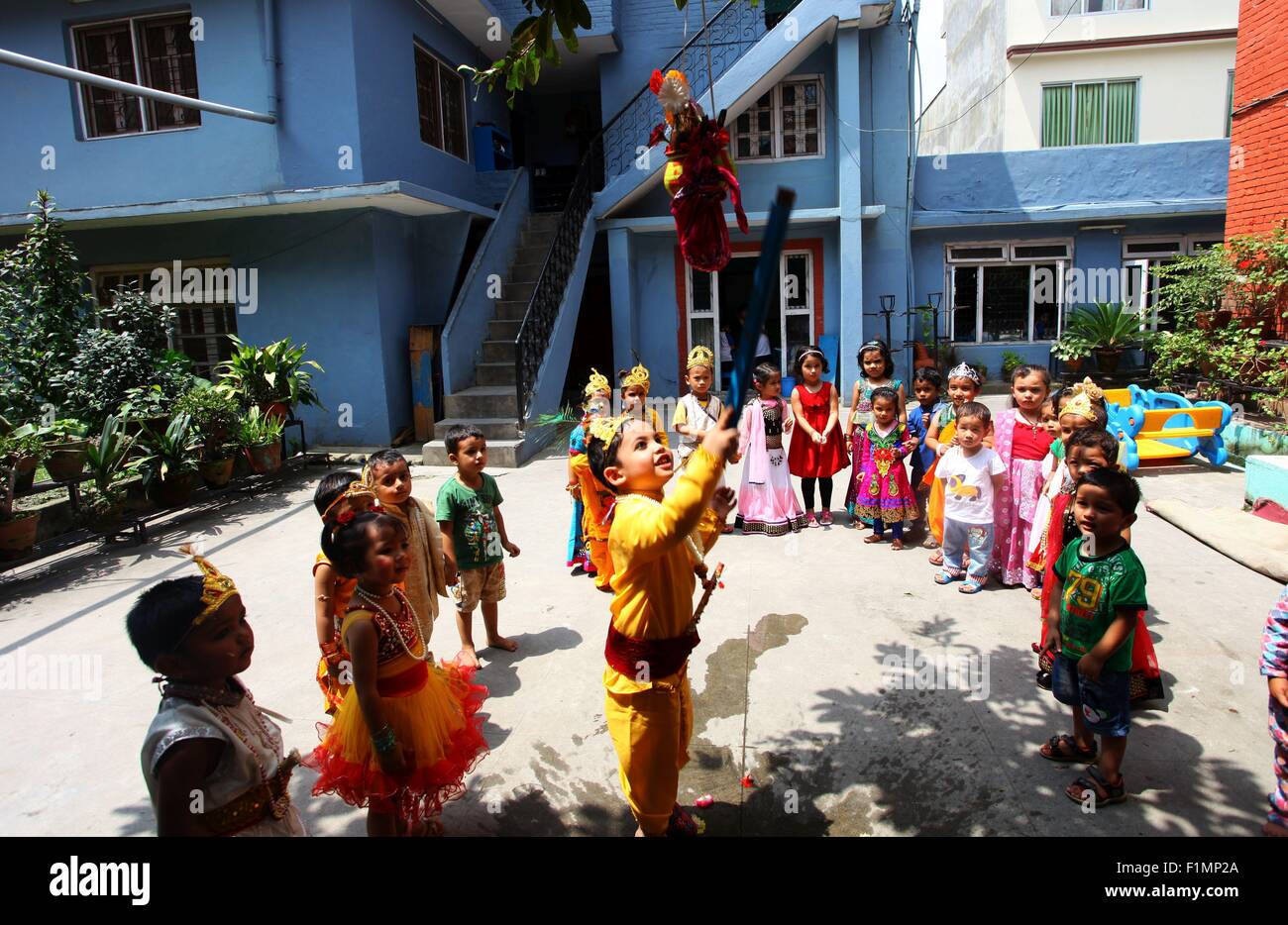 Kathmandu, Nepal. 4th Sep, 2015. Children dressed up as Radha and Lord Krishna play games during the celebration on the eve of Janmashtami festival at a local school in Kathmandu, Nepal, Sept. 4, 2015. Janmashtami festival, which marks the birthday of Hindu god Krishna, will be celebrated on Sept. 5. Credit:  Sunil Sharma/Xinhua/Alamy Live News Stock Photo