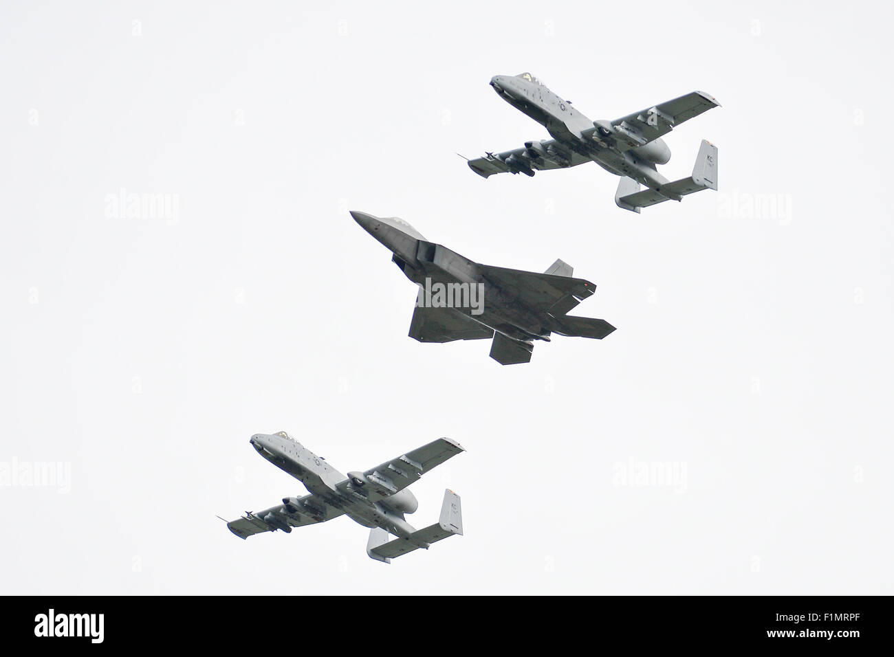 Amari. 4th Sep, 2015. Two A-10 and one F-22 aircrafts fly over the Amari airbase in Estonia on Sept. 4, 2015. U.S. Air Forces Europe and Air Forces Africa Public Affairs made trial flights at Amari Air Base, Estonia, a reinforcement of the increased flying operations in the Baltic and Europe, as well as Estonia's ability to support rotational deployments of U.S. Air Force aircraft. Credit:  Sergei Stepanov/Xinhua/Alamy Live News Stock Photo