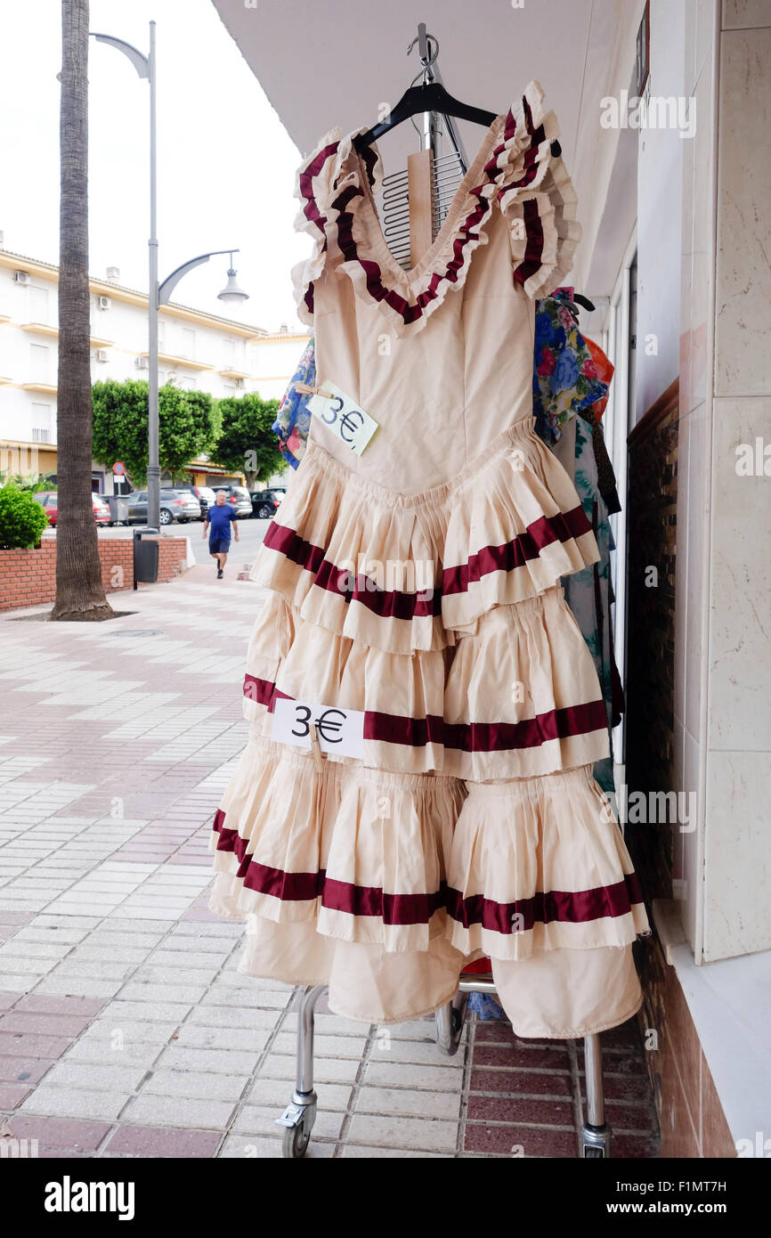 Flamenco dress on sale in second hand shop in Alhaurin el Grande, Andalusia, Spain. Stock Photo