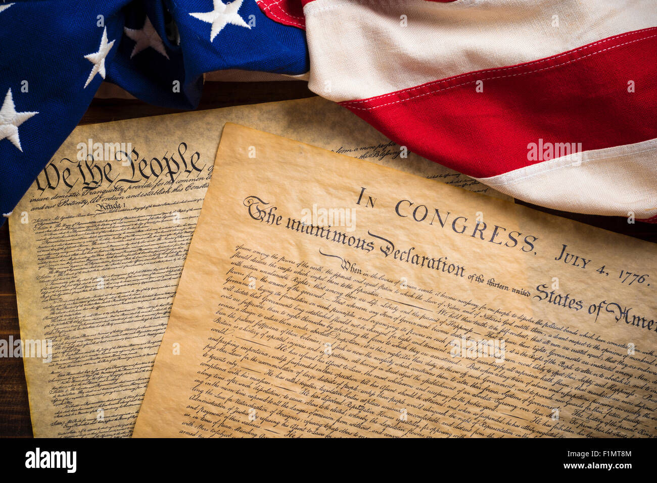 The Declaration of Independence and Constitution of the United States of America with a vintage flag Stock Photo