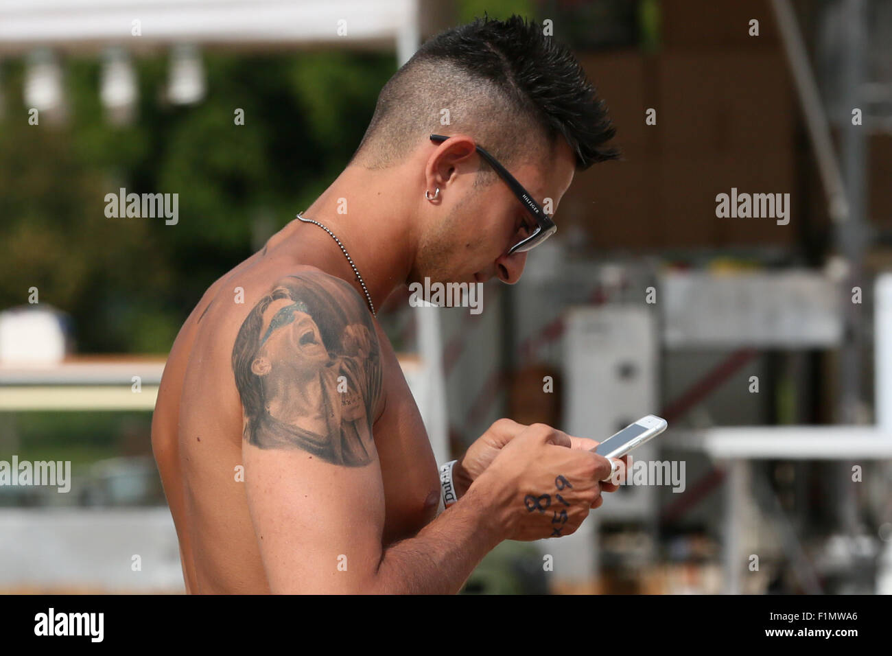 Turin, Italy. 04th Sep, 2015. A boy with a tattoo of Bono Vox, member of U2 band. Growing expectations for the first of only two Italian dates of 'U2 Innocence   Experience Tour 2015' © Elena Aquila/Pacific Press/Alamy Live News Stock Photo
