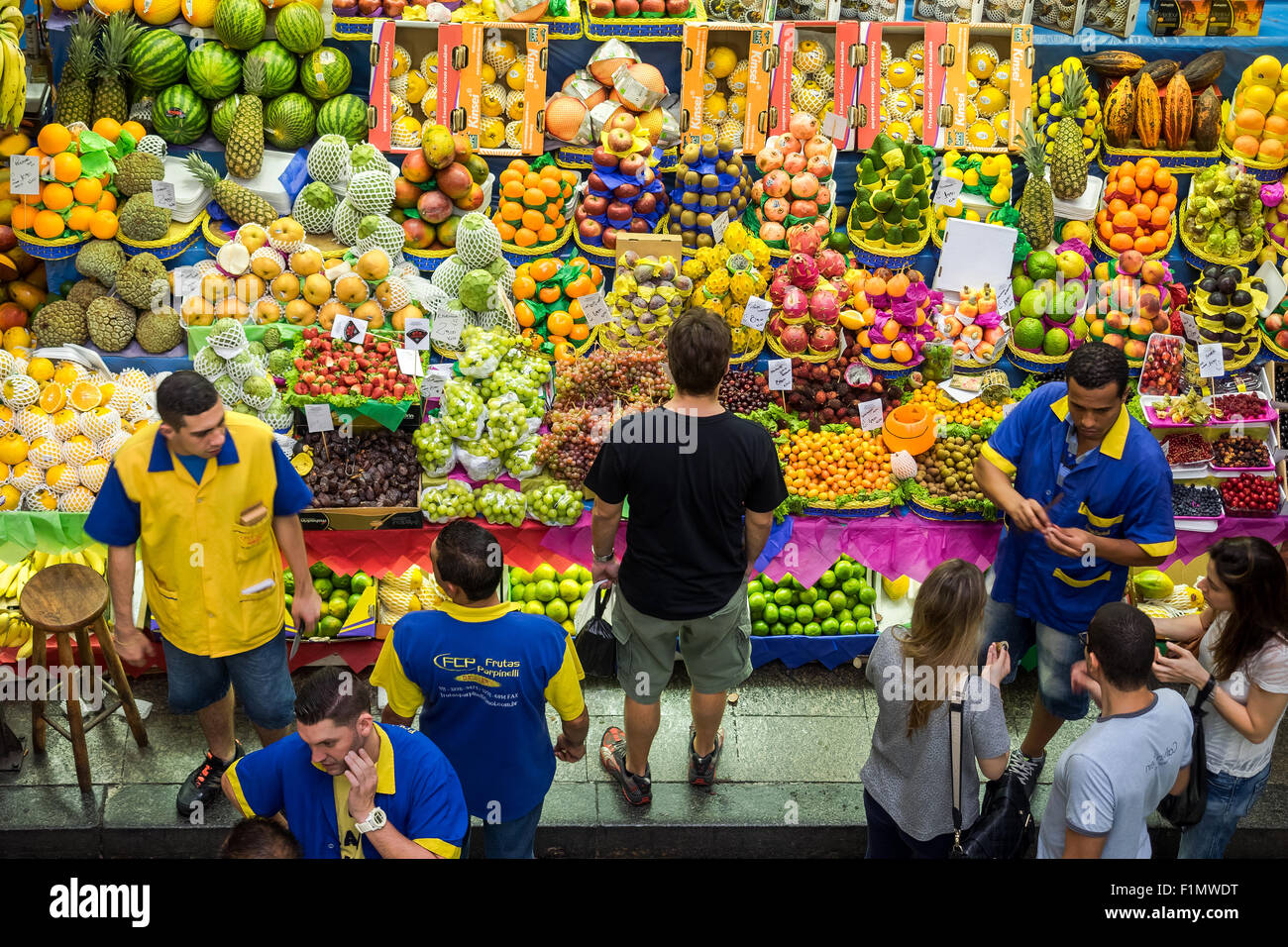 People grocery shopping at the traditional Municipal Market (Mercado Municipal), or Mercadao, in Sao Paulo, Brazil. Stock Photo