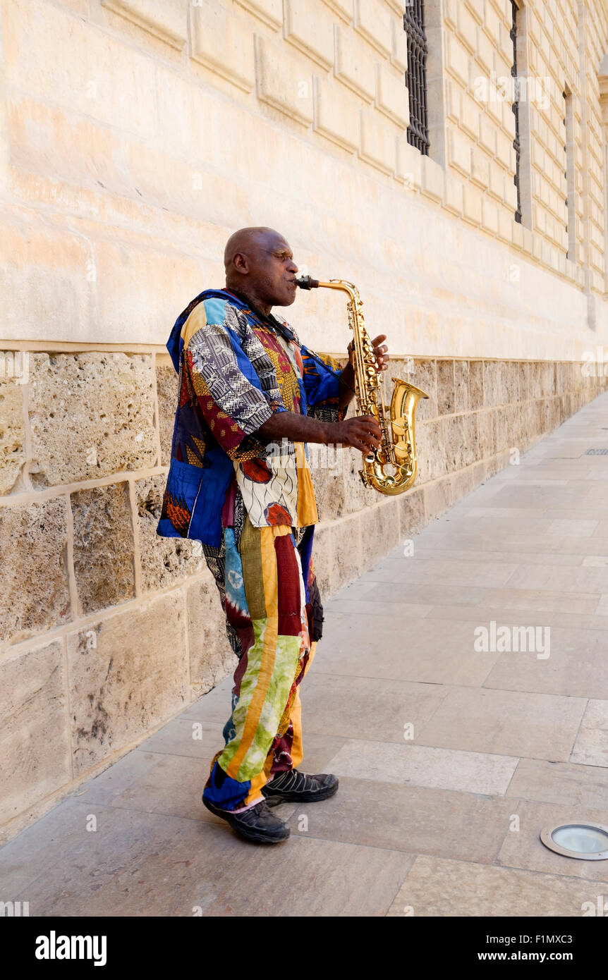 Colourful Dressed African Sax Player Playing On Street In Malaga Stock Photo Alamy alamy