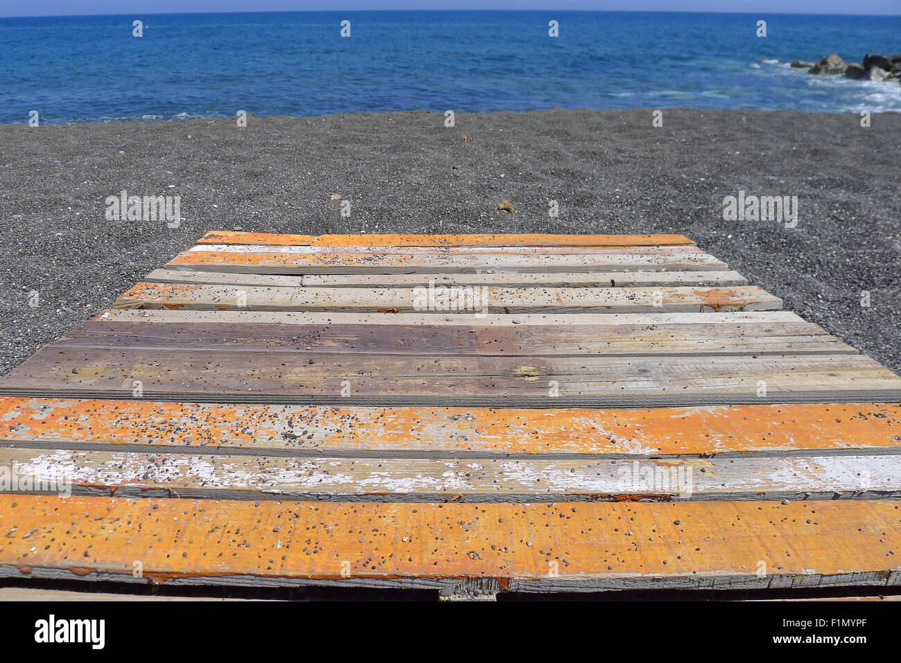 orange and white platform at beach, Kamari Santorini Stock Photo