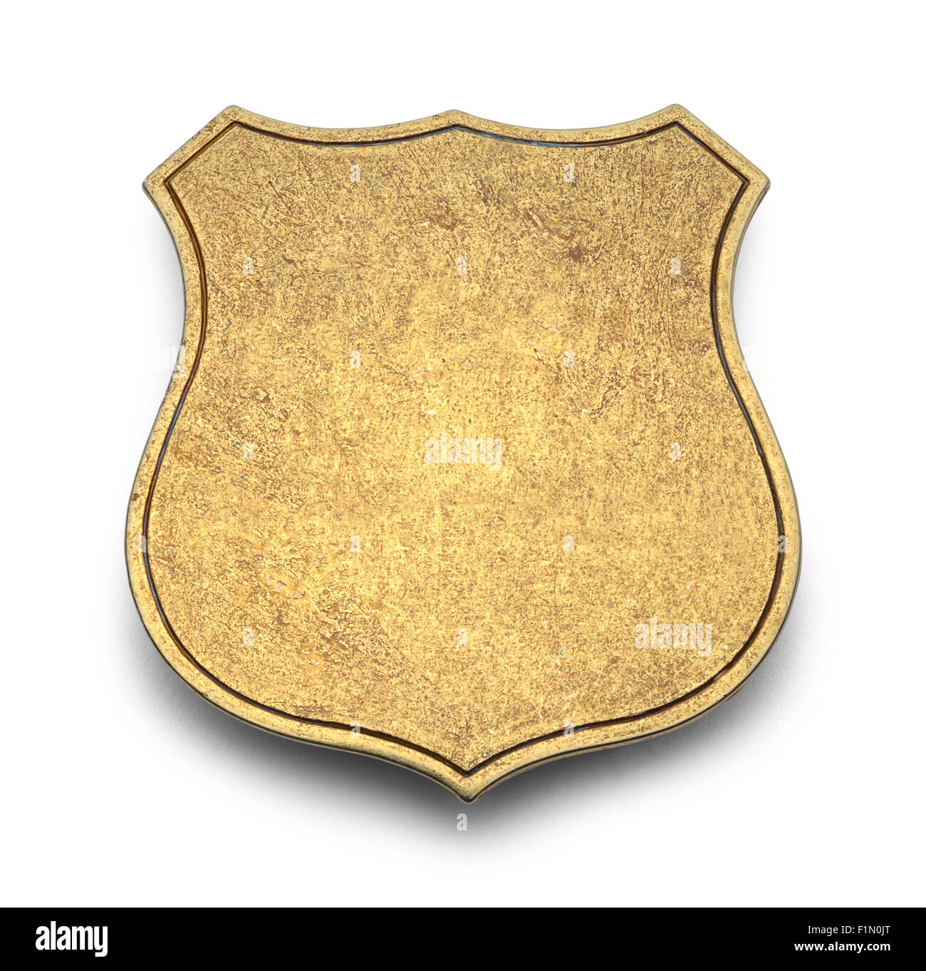 Gold Shield Badge with Copy Space Isolated on White Background. Stock Photo