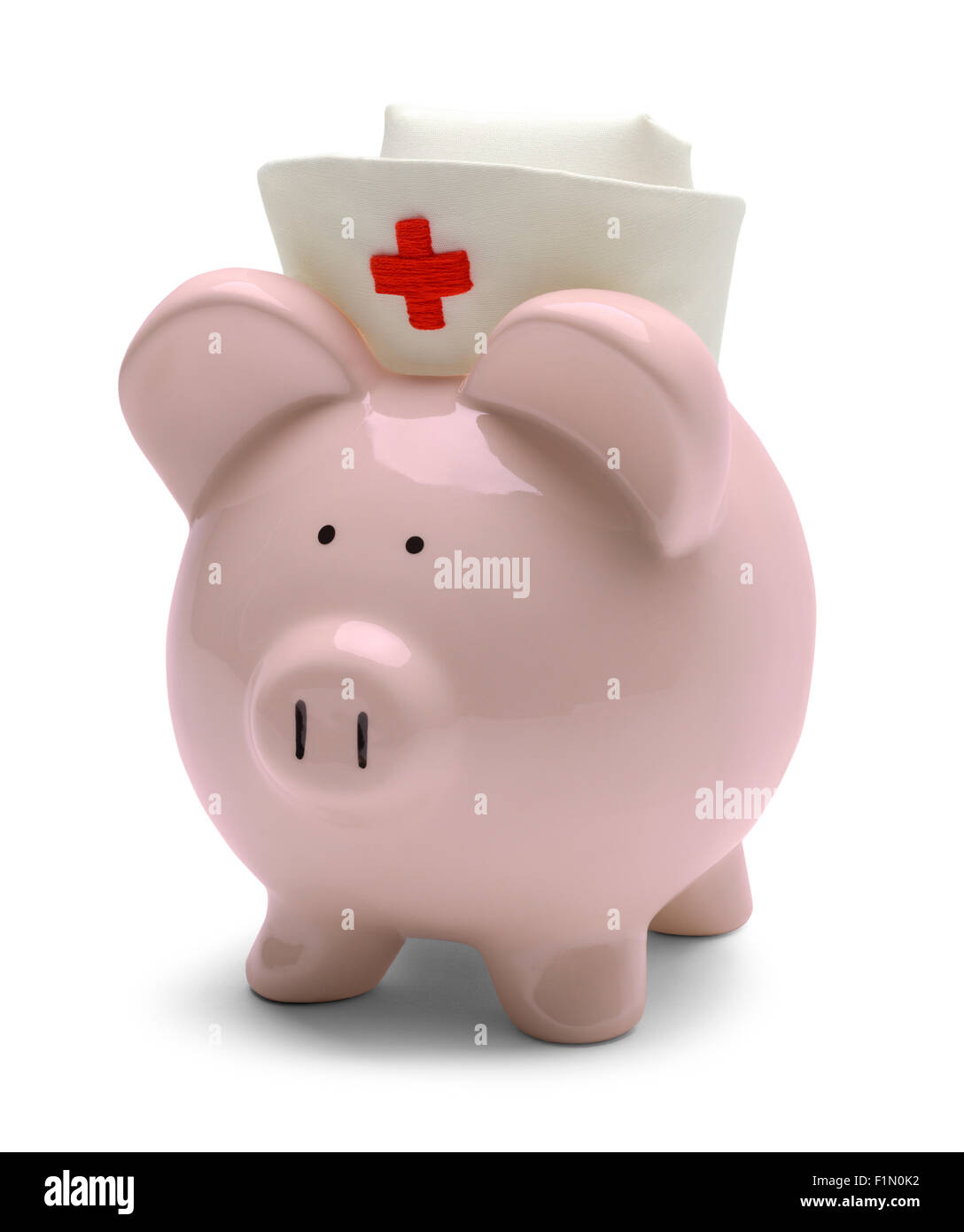Piggy Bank with Nurse Hat Isolated on White Background. Stock Photo