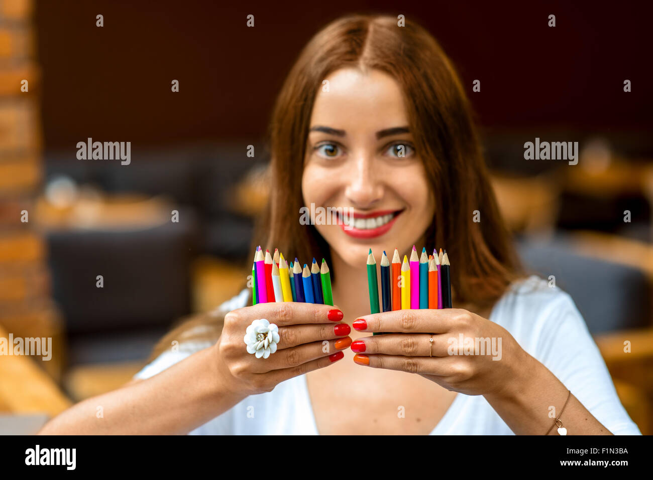 Woman with pencil hi-res stock photography and images - Alamy