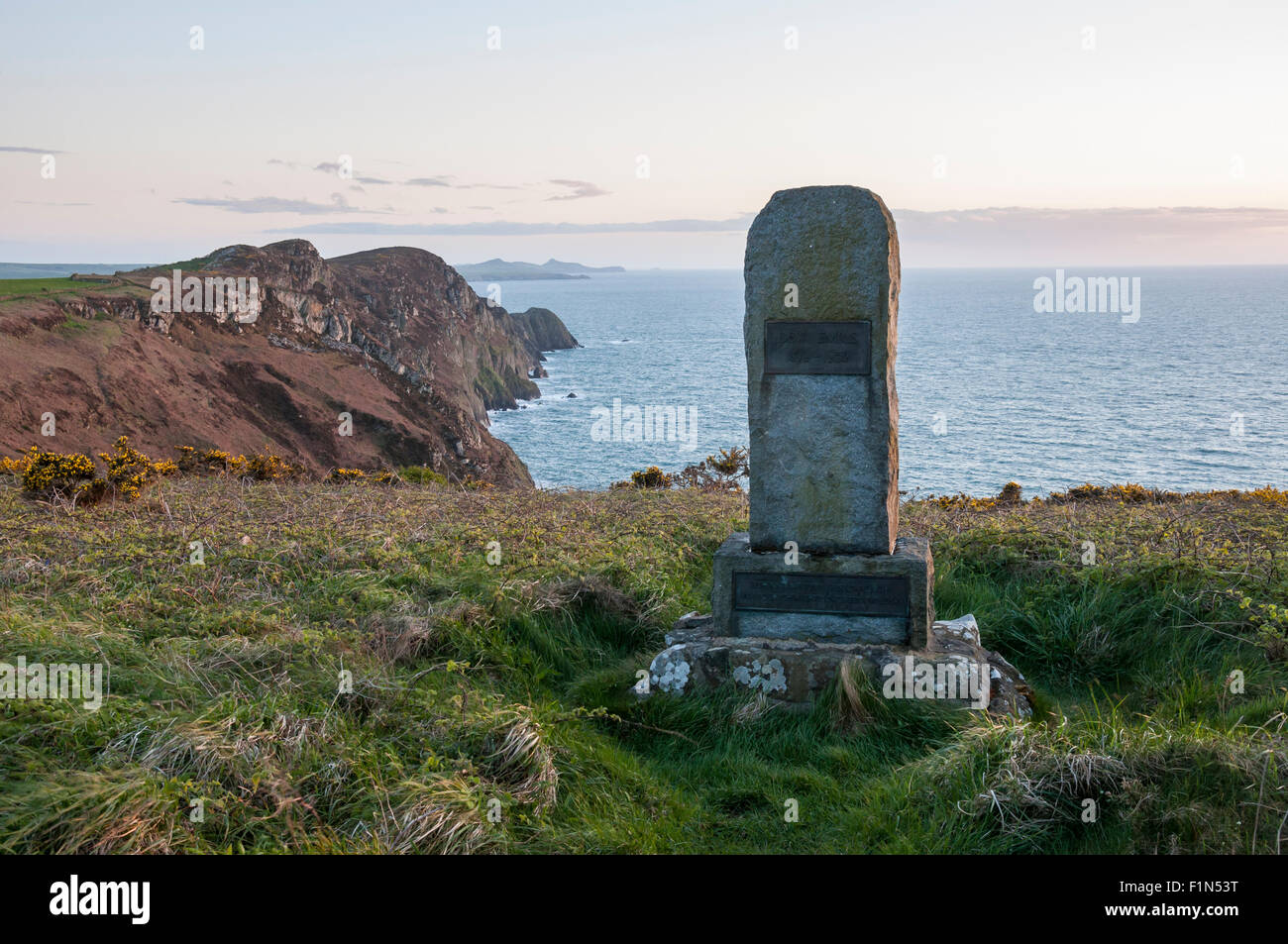 A memorial stone to Dewi Emrys at Pwll Deri on the coast of North Pembrokeshire, Wales. Stock Photo