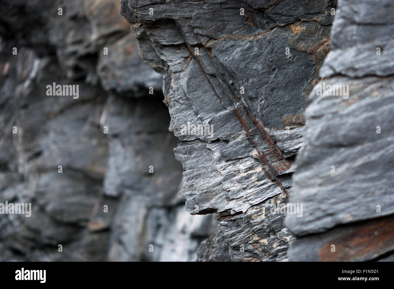 Jagged rocks on cliffs at a North Pembrokeshire beach near Abermawr. Stock Photo